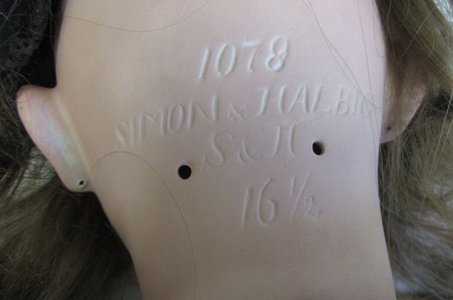 A large Simon & Halbig bisque socket head doll with brown glass sleeping eyes Image