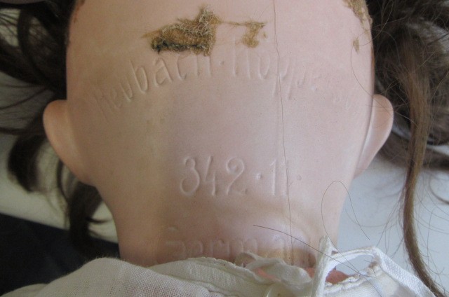 A Heubach Koppelsdorf bisque socket head character doll with blue glass sleeping eyes Image