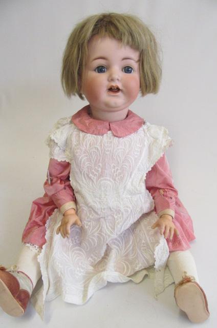 A Kammer & Reinhardt bisque socket head character doll with blue glass paperweight sleeping eyes Image