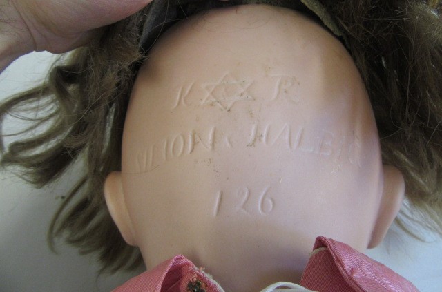 A Kammer & Reinhardt bisque socket head character doll with blue glass paperweight sleeping eyes Image