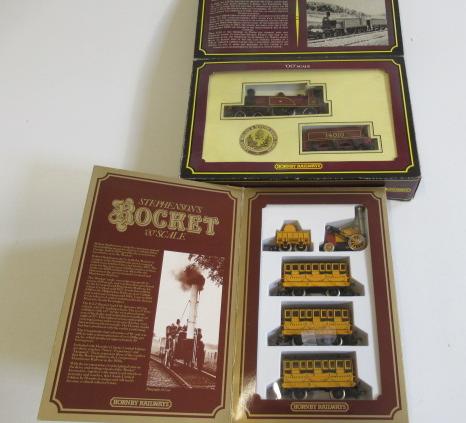 Hornby Late issue Stephenson's Rocket and three coaches Image