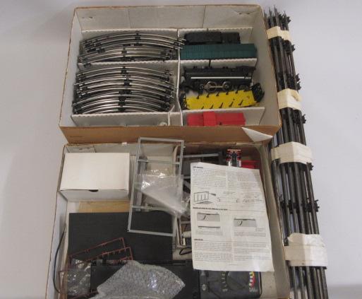 Late issue Lionel Flyer Train Set with 4-4-2 Locomotive and three goods trucks together with a Image