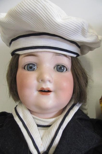 An Armand Marseille bisque socket head black doll Image