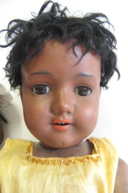 An Armand Marseille bisque socket head black doll Image