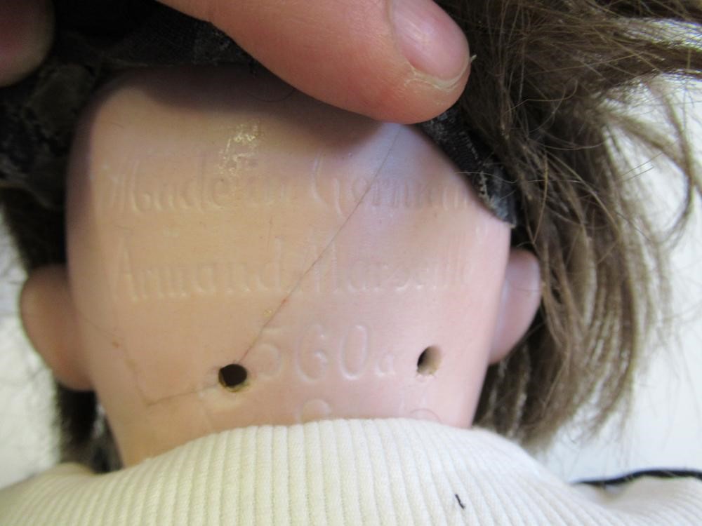 An Armand Marseille bisque socket head black doll Image