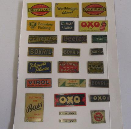 Twenty four tinplate line side advertising sign by Bassett-Lowke including Oxo Image