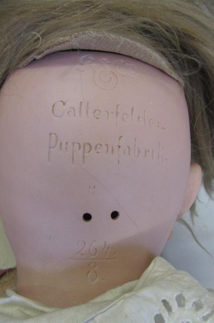 A Catterfelder Puppenfabrik bisque socket head doll with blue glass sleeping eyes Image