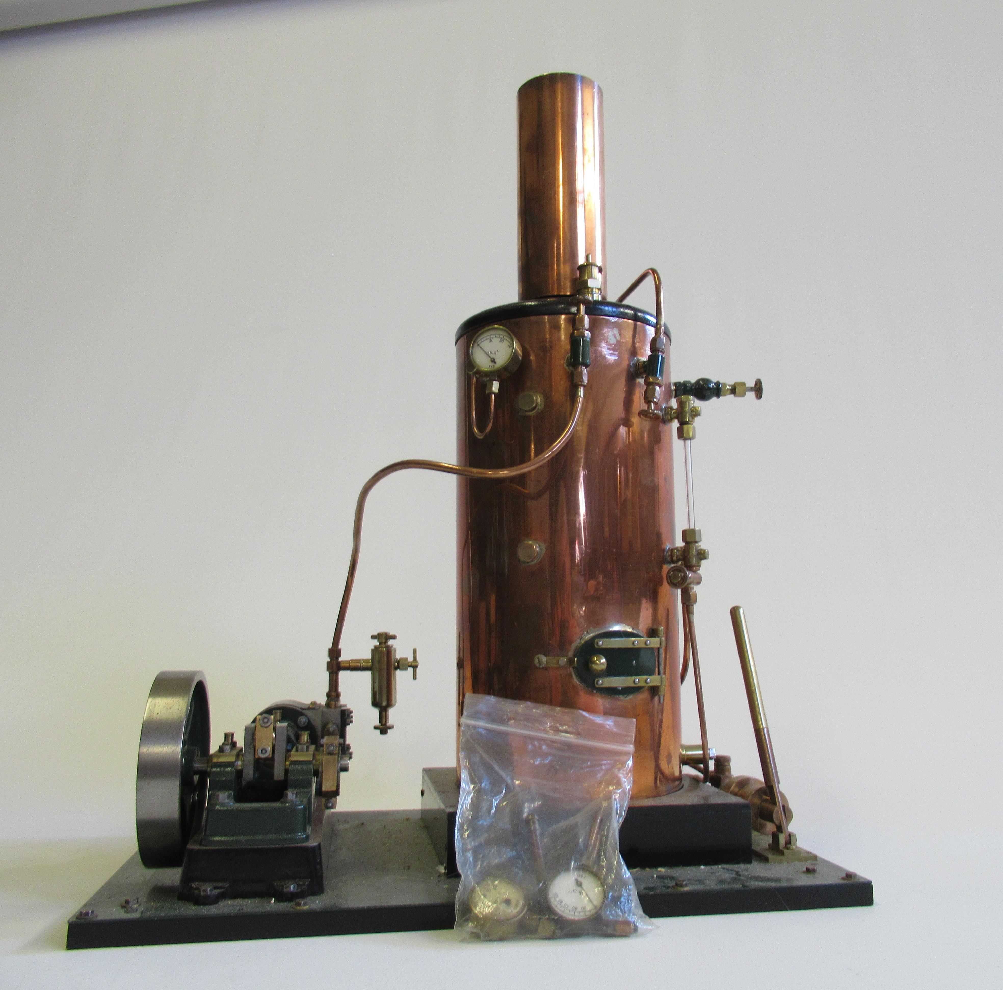 A coal fired vertical boiler steam engine with non-reversing single cylinder mill engine Image