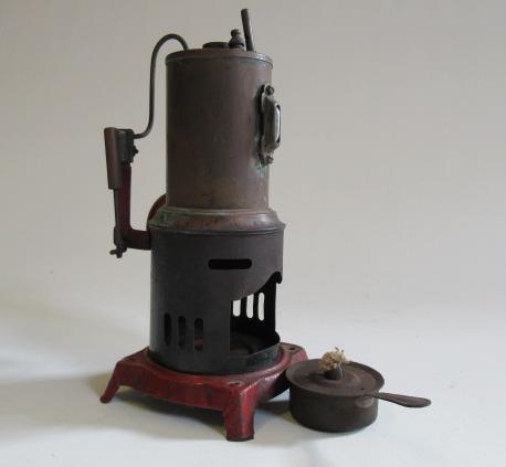 A German made small vertical steam engine with single cylinder and spirit fired boiler Image