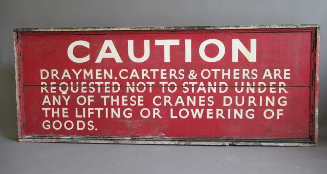 A large wooden warning sign Image