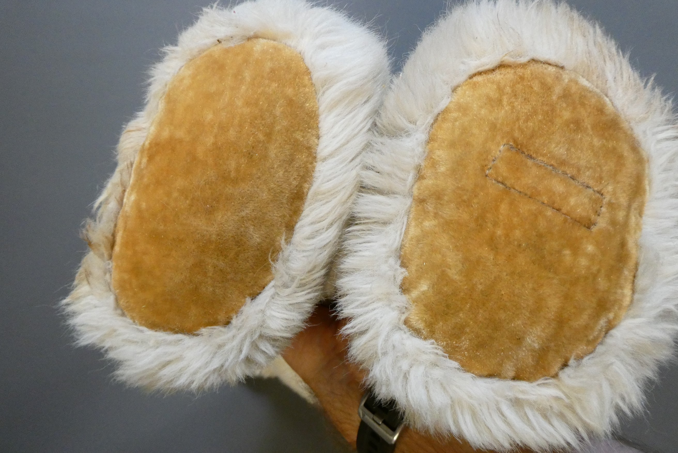 A large Merrythought white teddy bear, with clear glass eyes, sewn nose, felt pads and label, 33" Image