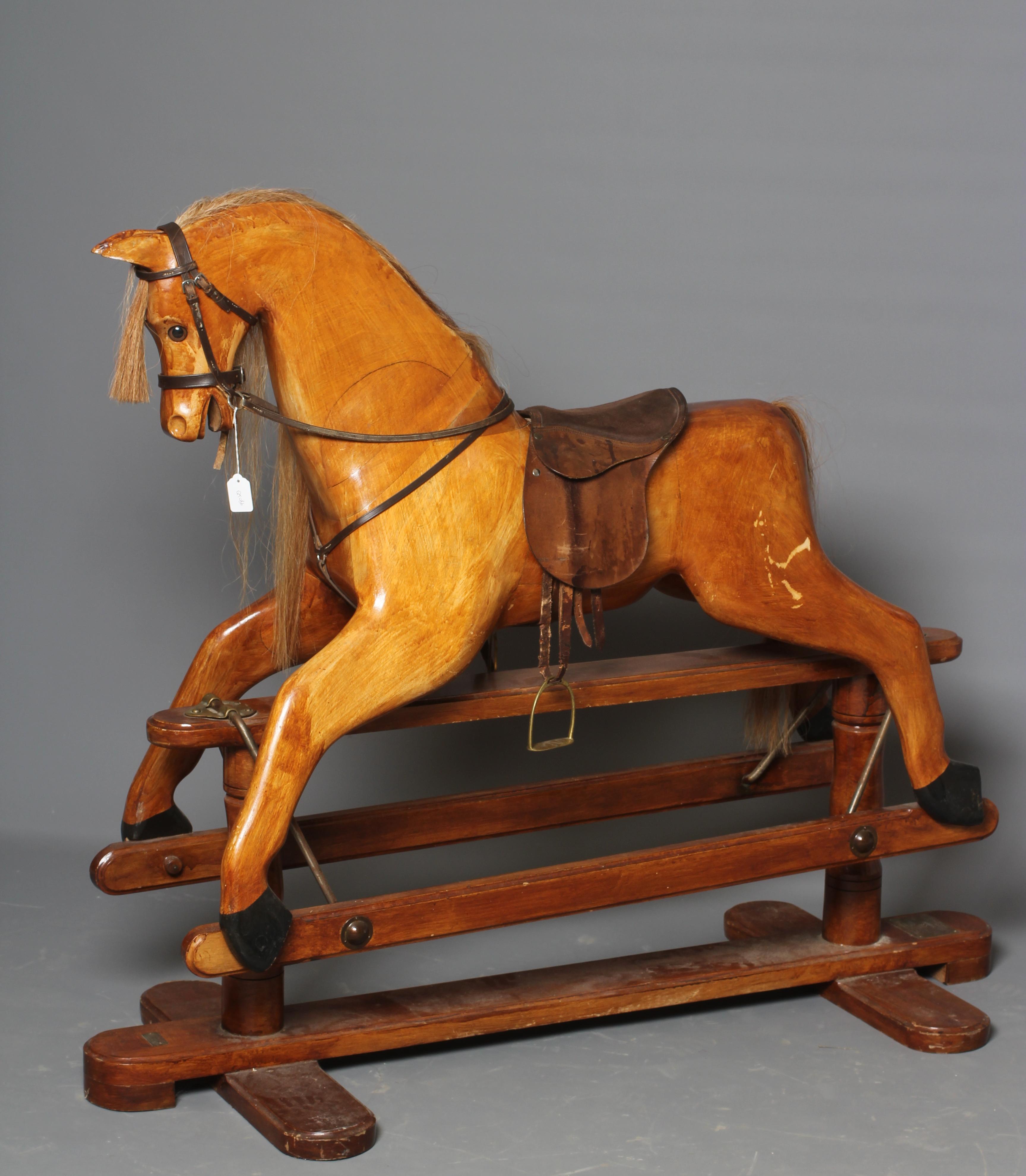 A House of Marbles rocking horse, of carved wood construction, with clear eyes, horse hair mane and Image