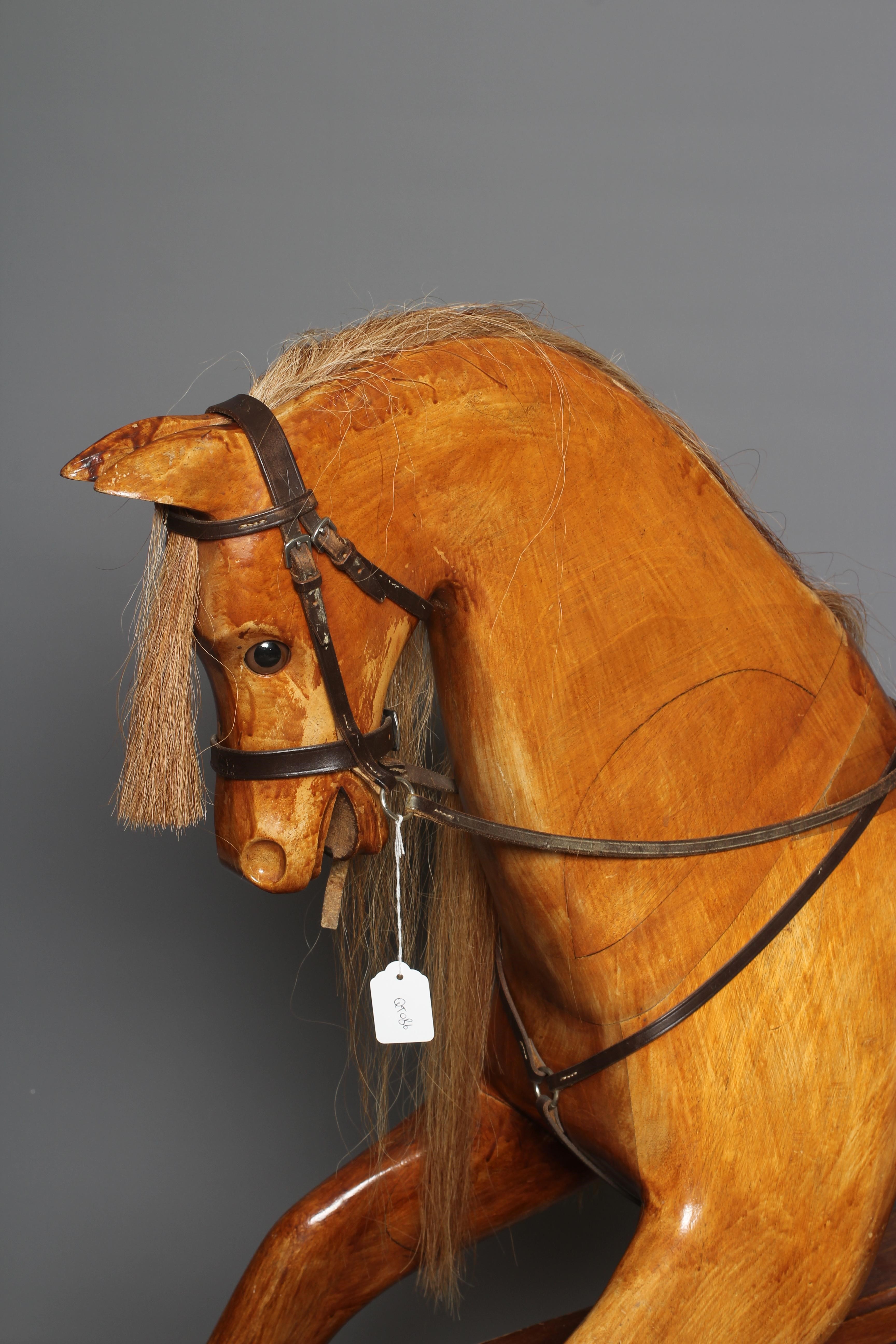 A House of Marbles rocking horse, of carved wood construction, with clear eyes, horse hair mane and Image