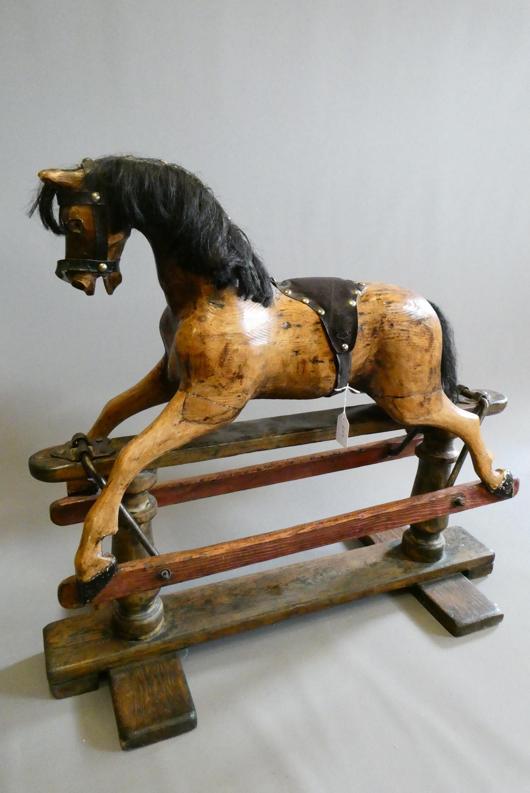 A doll's rocking horse Image