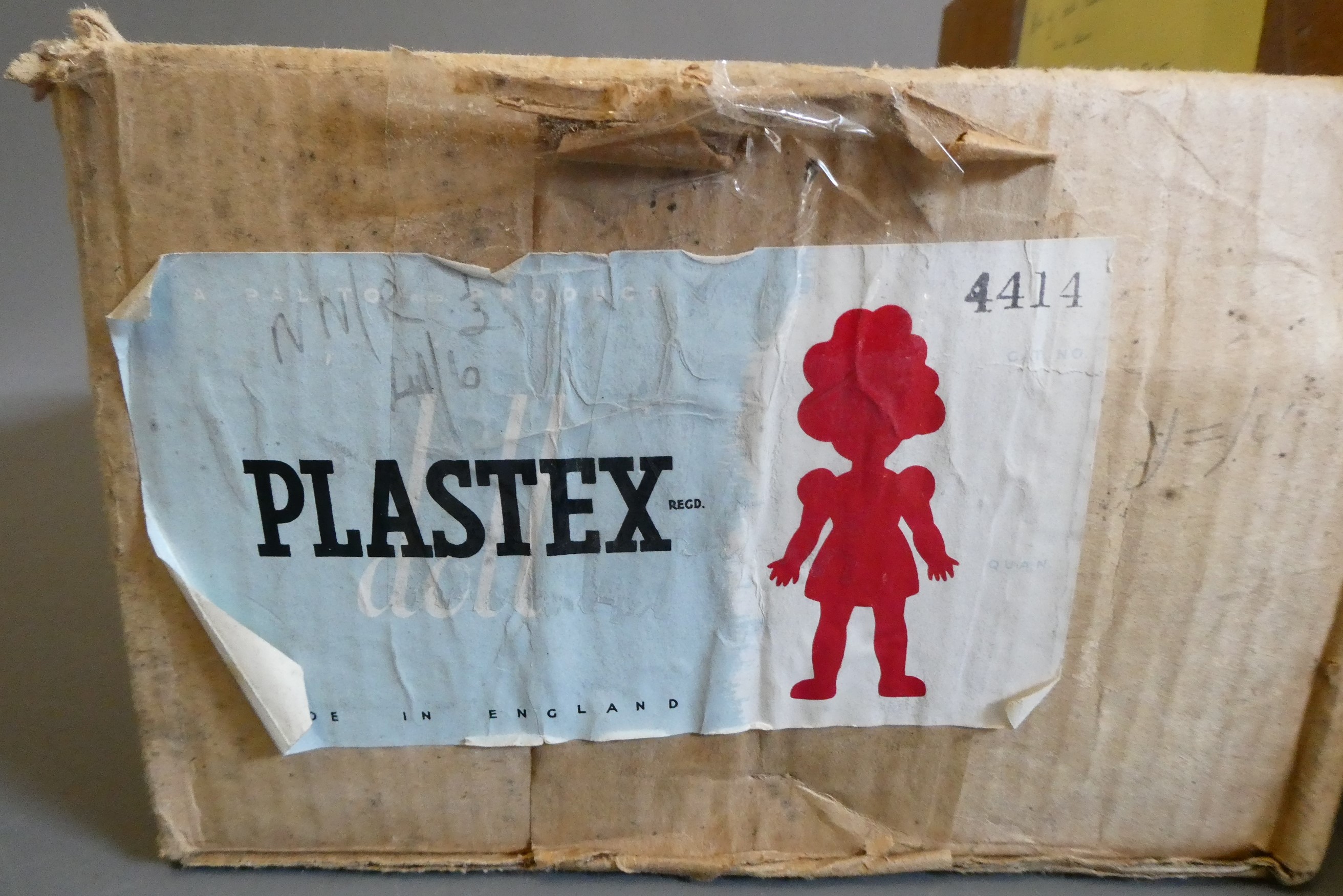 A collection of vintage dolls and clothing Image