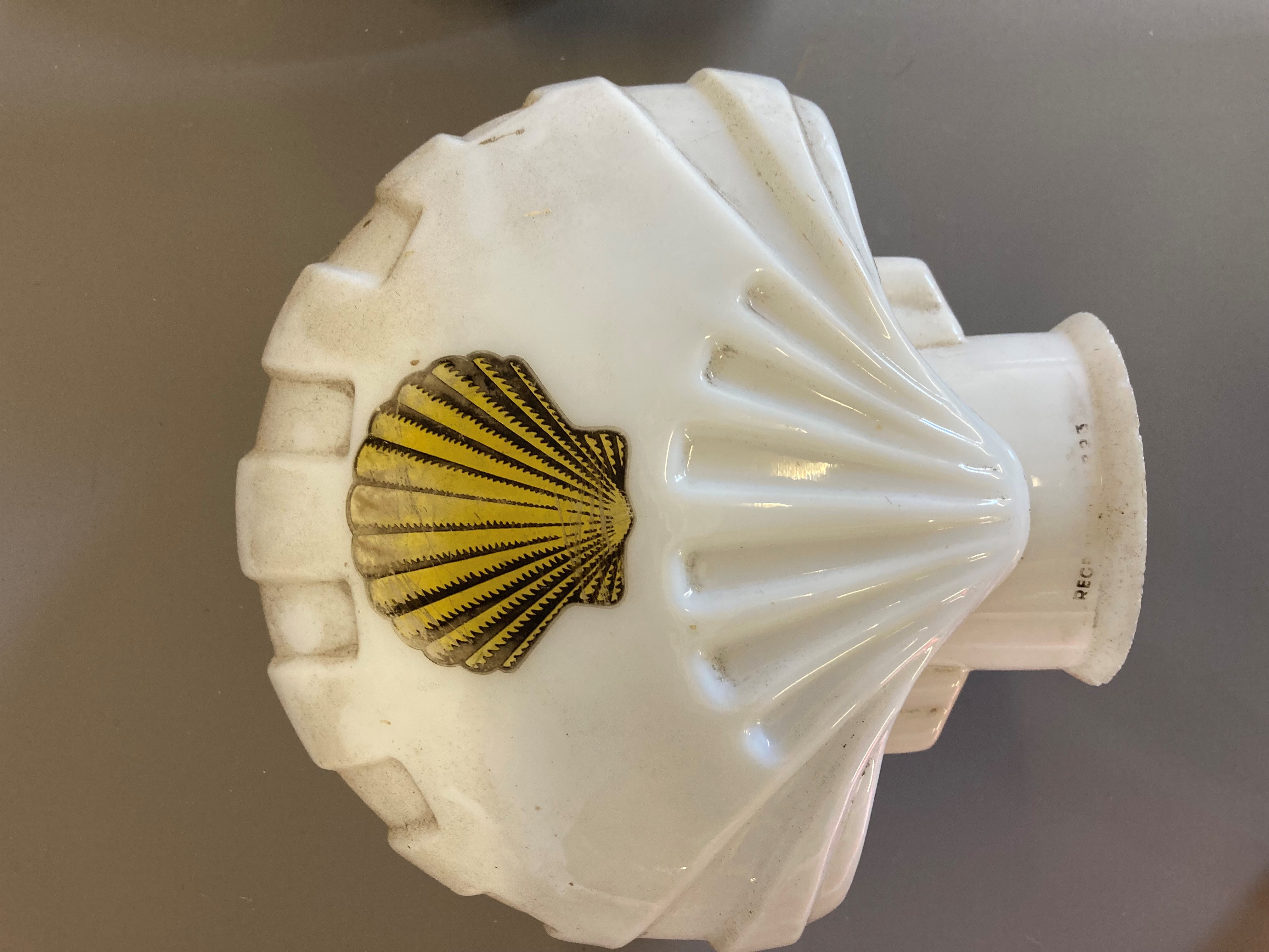 Four small petrol pump type glass globes, including two Shell examples, minor faults to three, Image