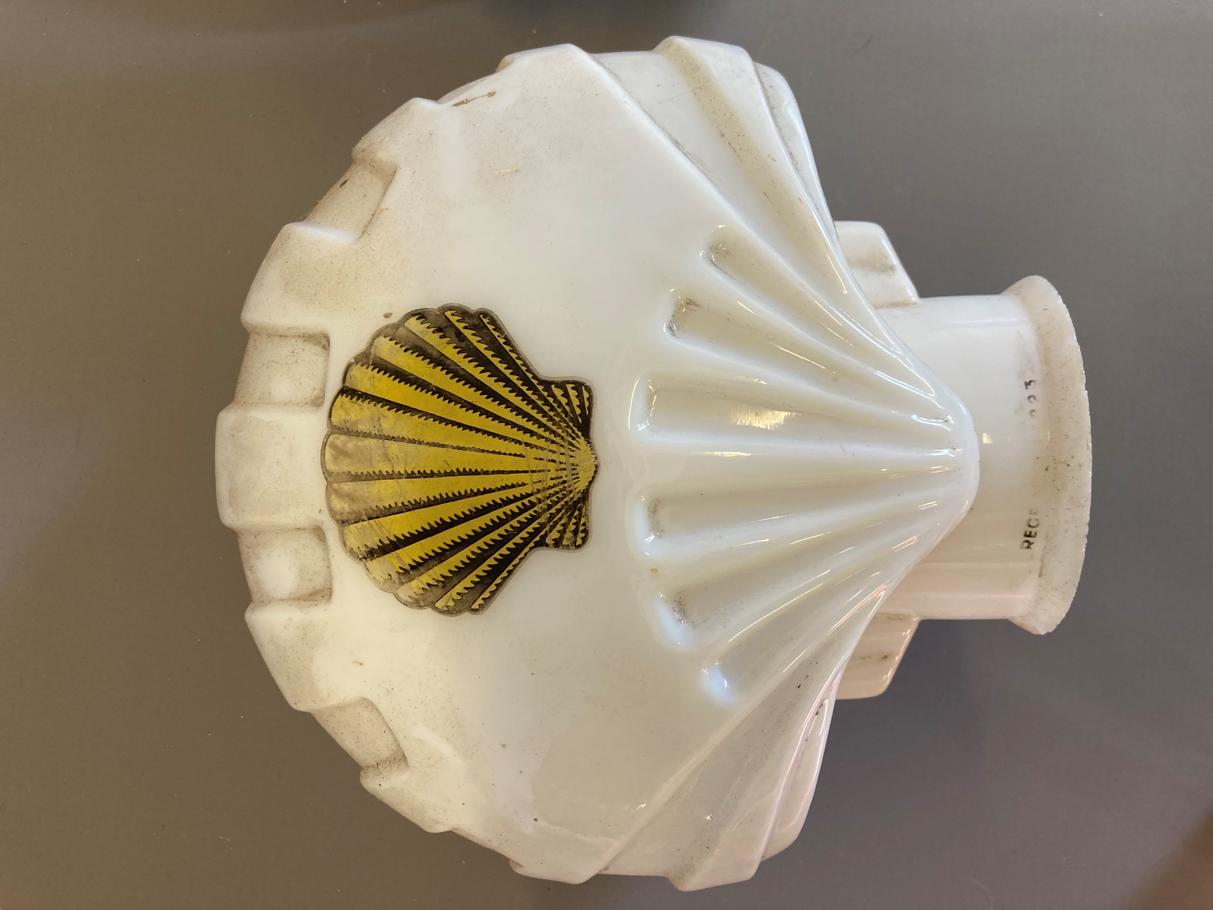 Four small petrol pump type glass globes, including two Shell examples, minor faults to three, Image