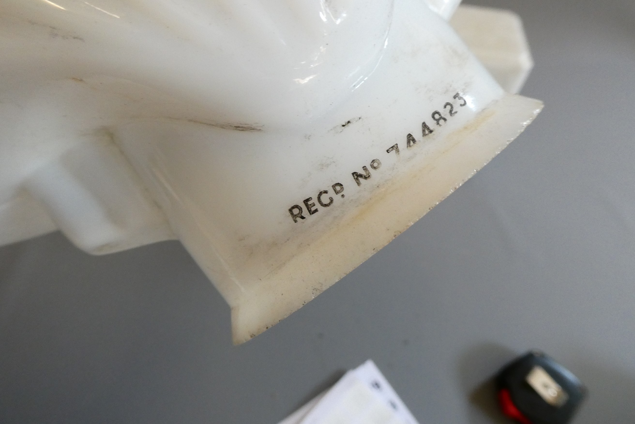 Four small petrol pump type glass globes, including two Shell examples, minor faults to three, Image