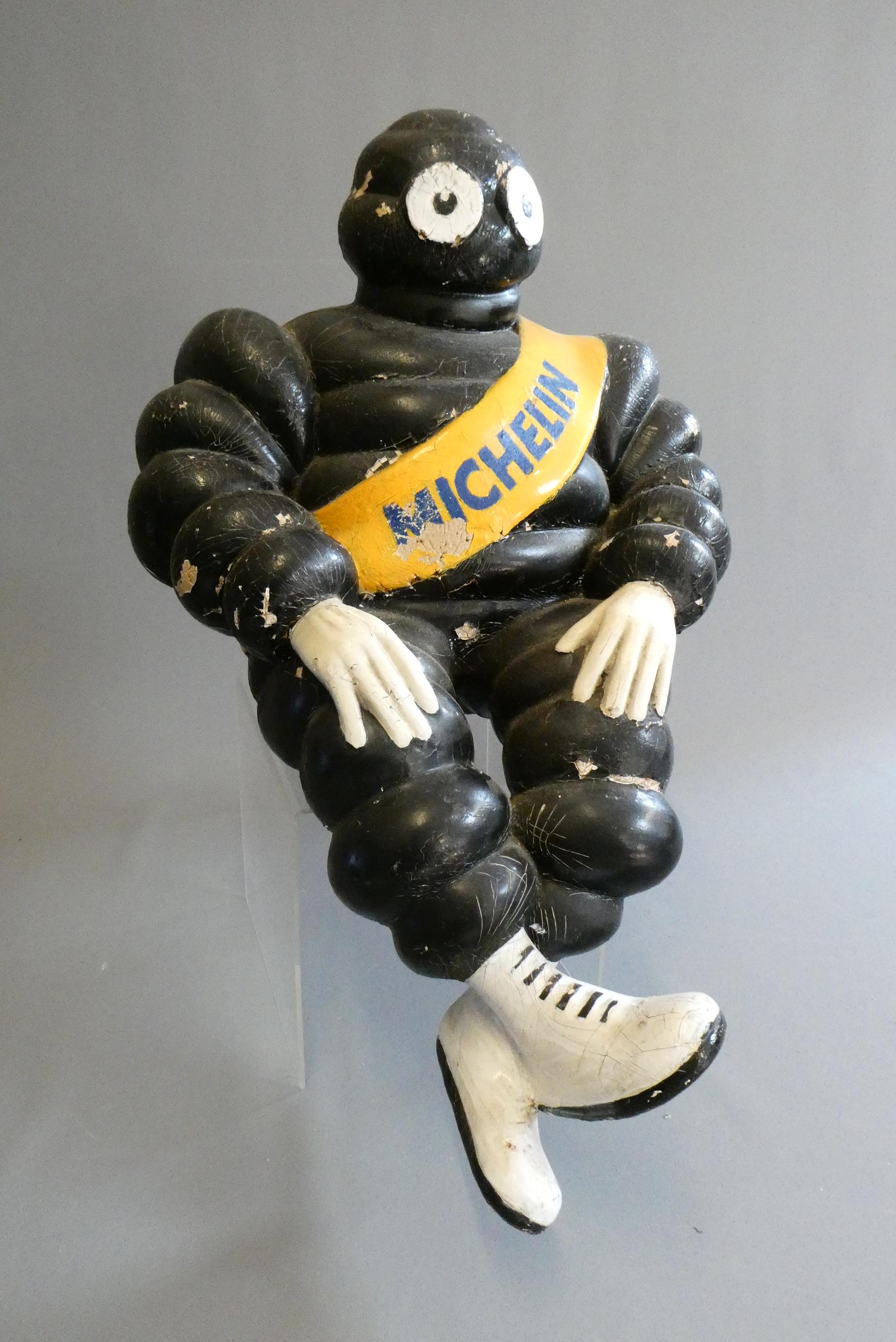 Michelin man, composition construction painted, modelled sitting, 23" overall, crazing and paint Image