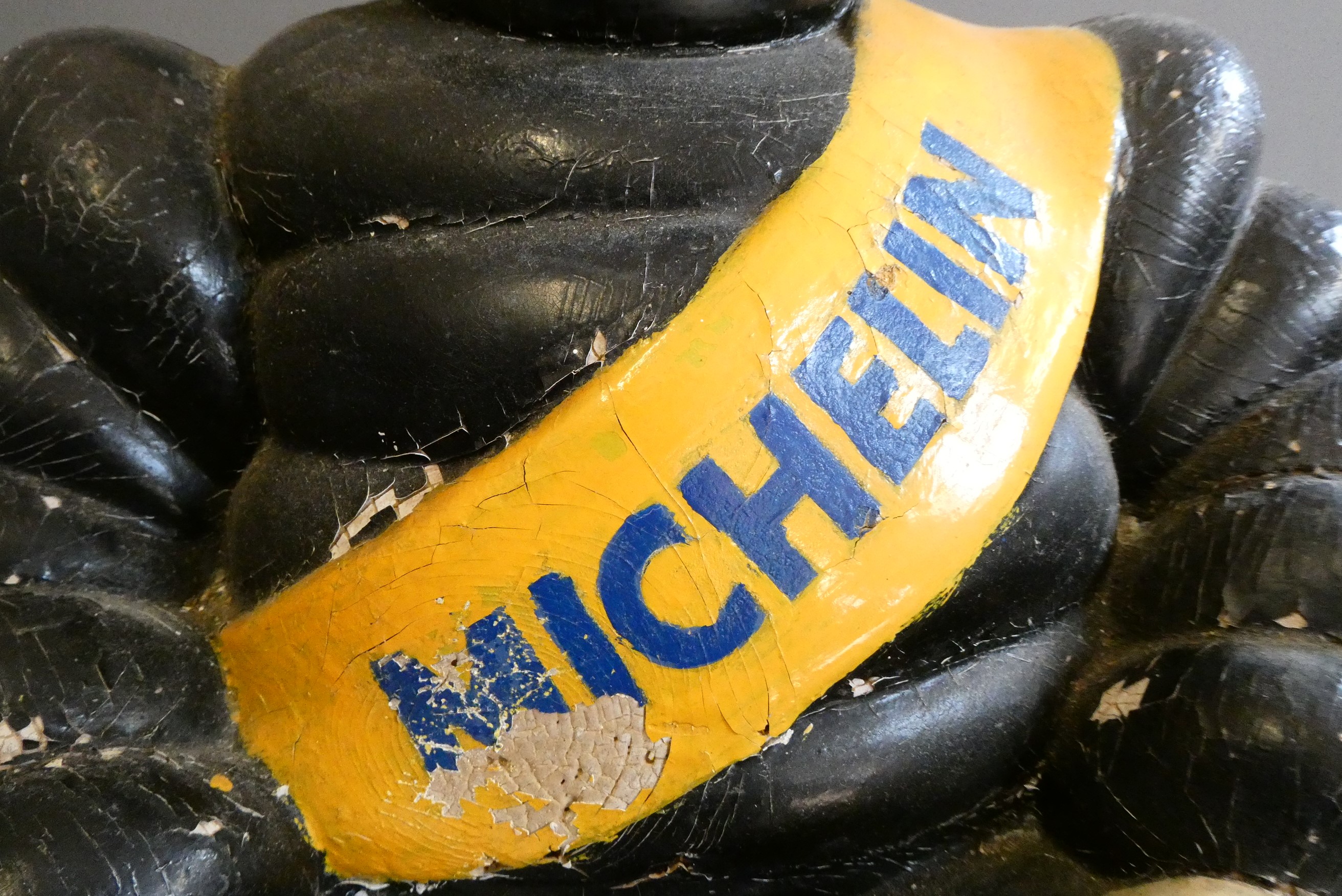 Michelin man, composition construction painted, modelled sitting, 23" overall, crazing and paint Image