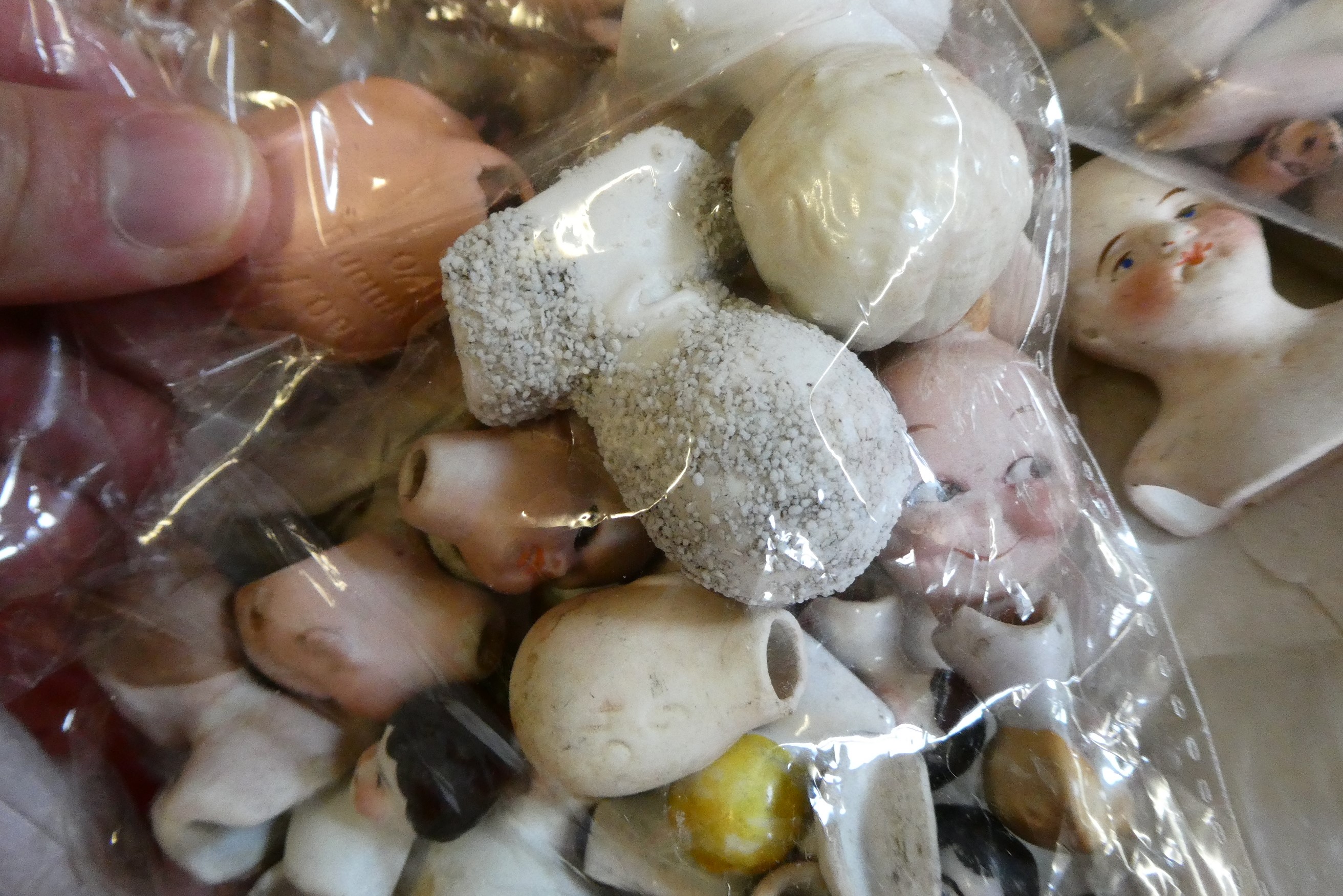 Approximately 40 antique doll's house doll heads and body parts (Est. plus 24% premium inc. VAT) Image