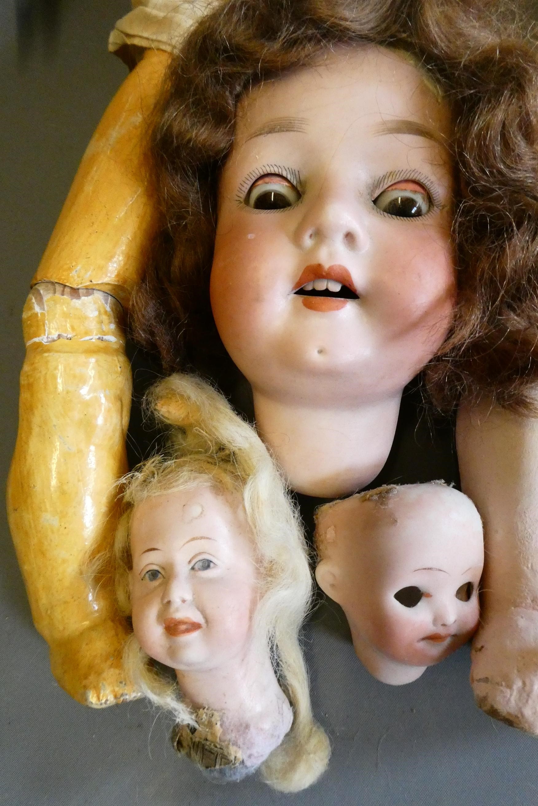 An assortment of doll's and doll parts Image