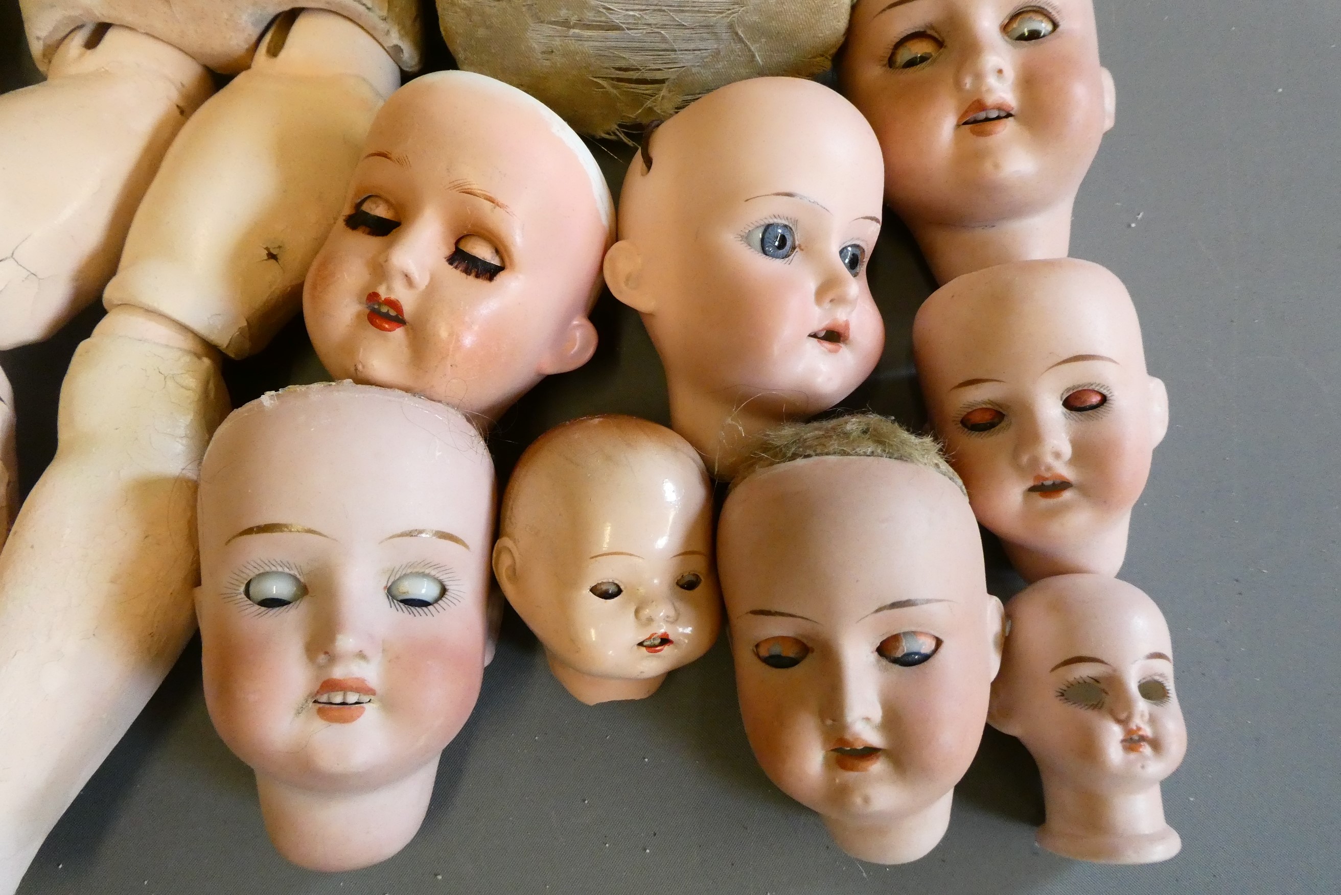 An assortment of doll's and doll parts Image