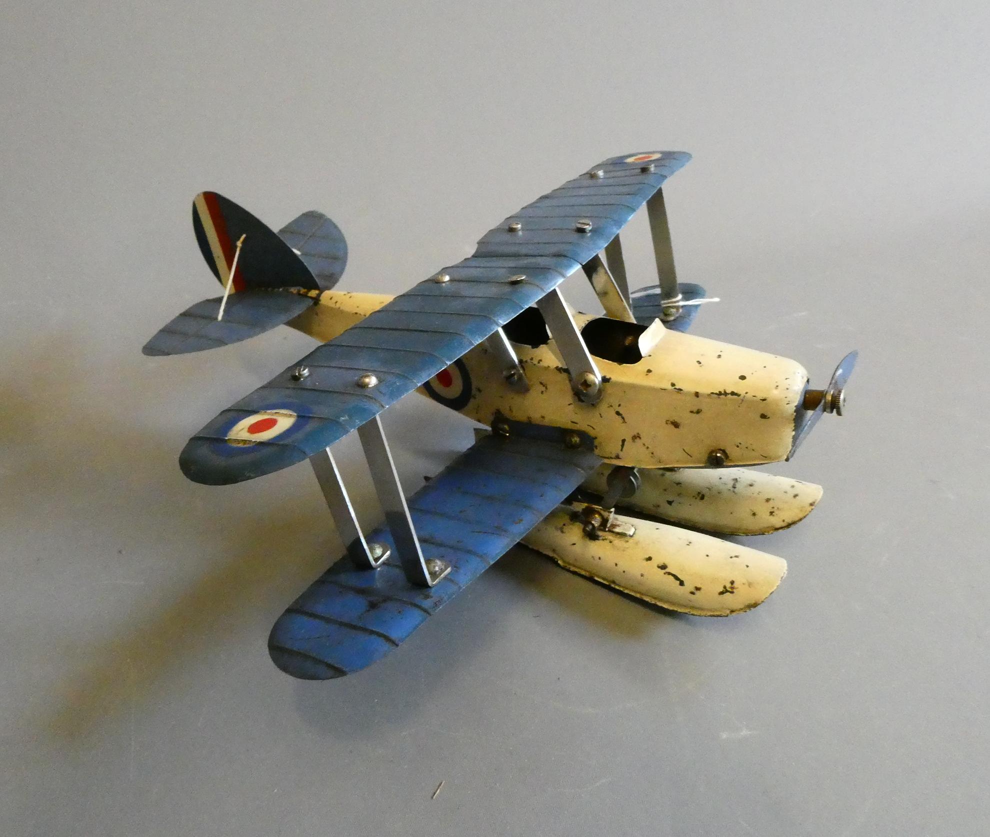 Meccano No1 sea plane finished in blue and white, fitted with floats. Some overpainting, some paint Image
