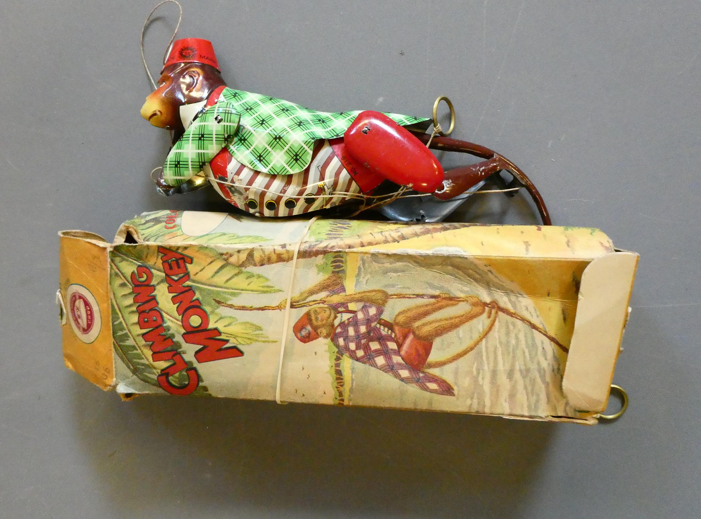 Early China made (Hong Kong) tin-plate litho-printed climbing monkey. Box fair, toy good (Est. plus Image