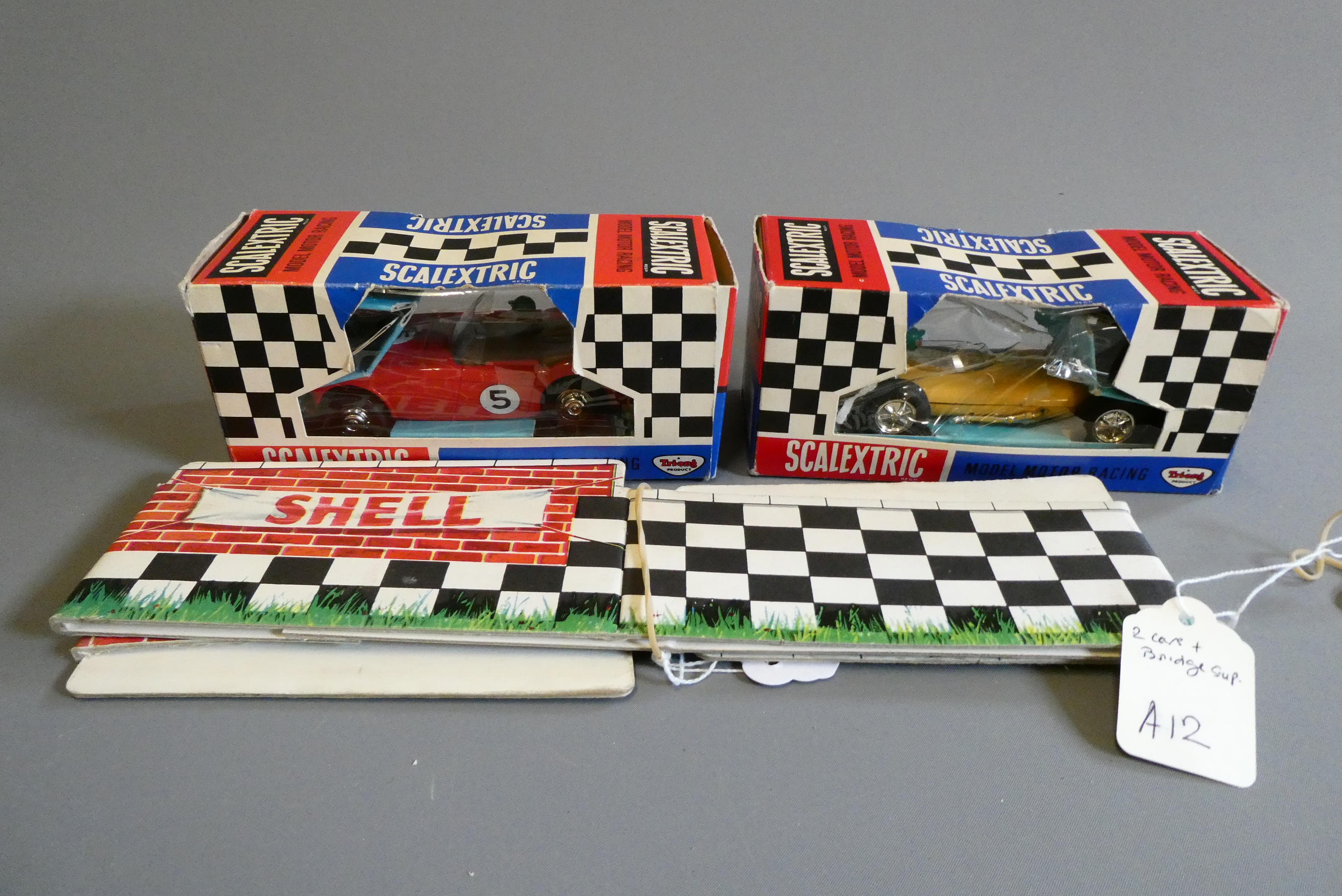 Scalextric Austin Healey in red and a C54 Lotus race car in yellow Image