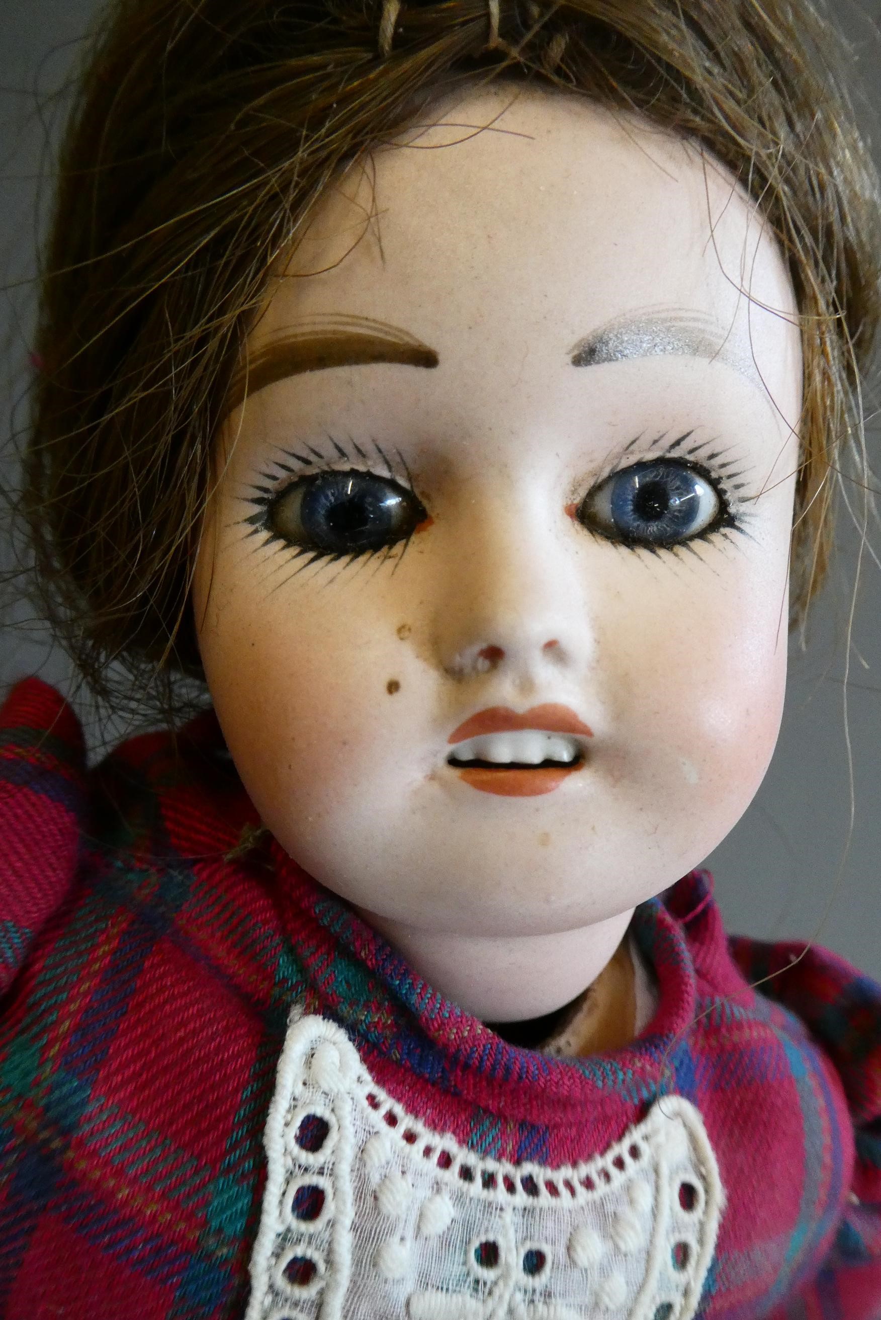 Three bisque socket head dolls comprising an 18" Heubach Koppelsdorf 320 3 doll with blue glass Image