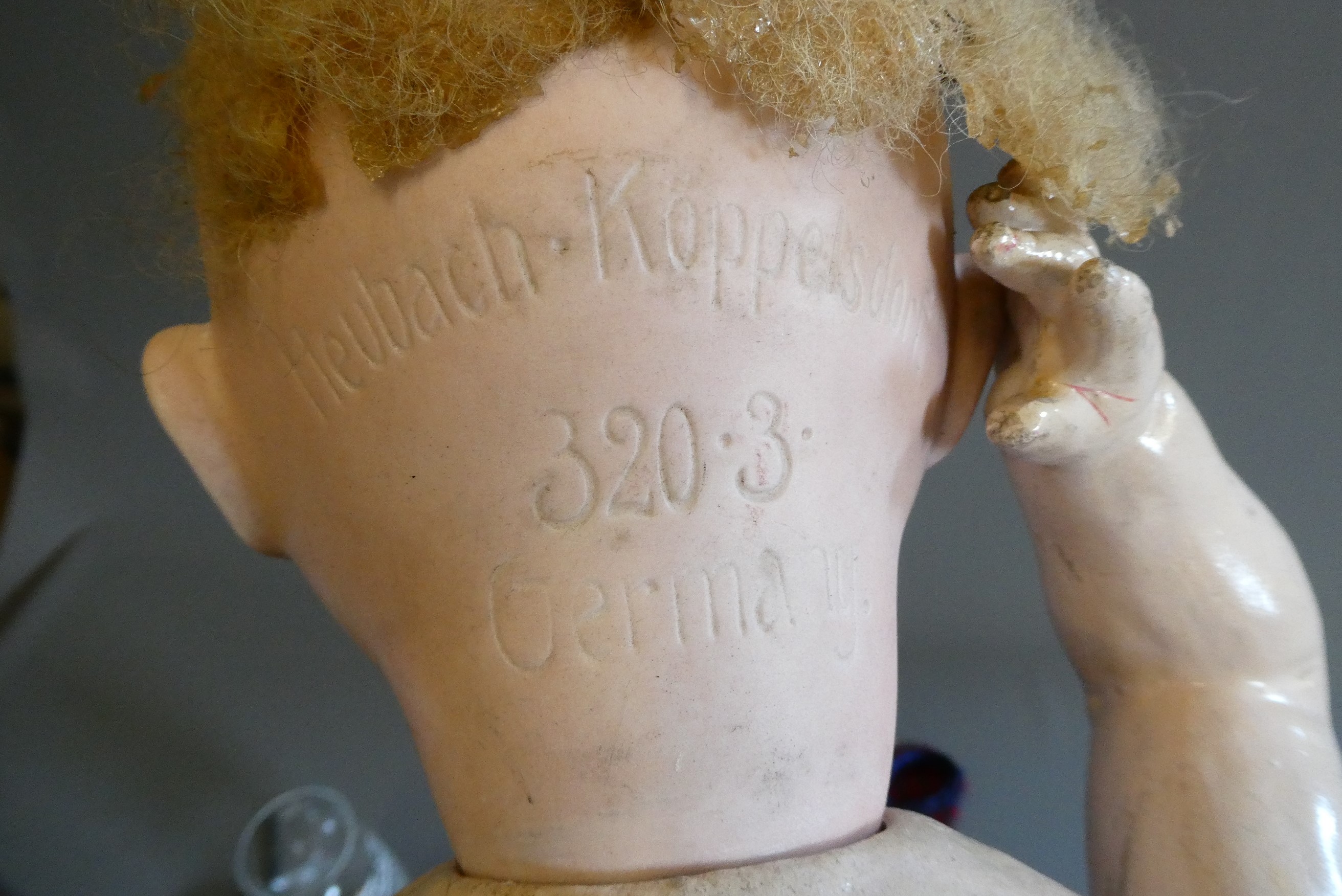 Three bisque socket head dolls comprising an 18" Heubach Koppelsdorf 320 3 doll with blue glass Image