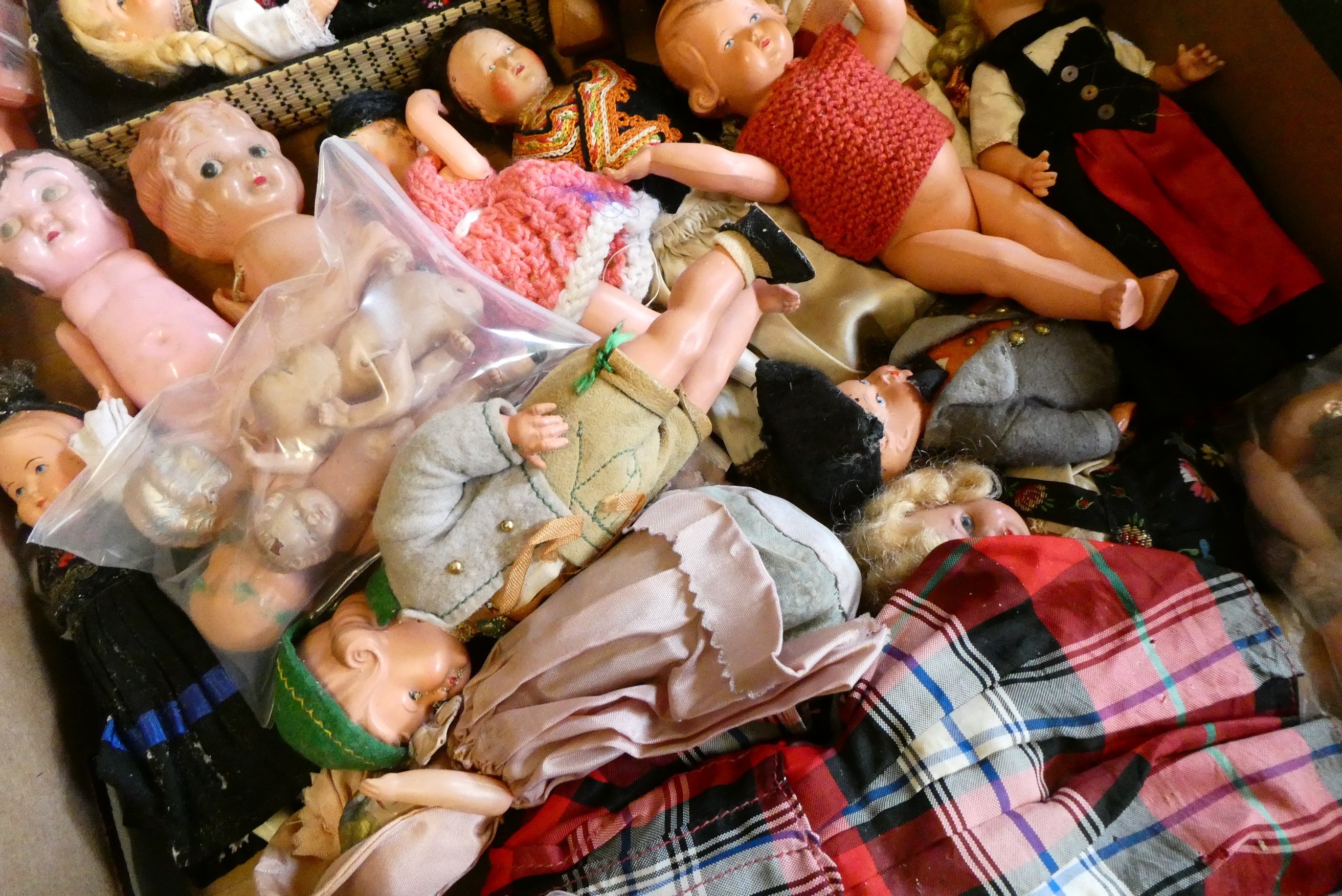 A collection of vintage celluloid dolls, including Roly Dolls, most in original dress (Est. plus 24% Image