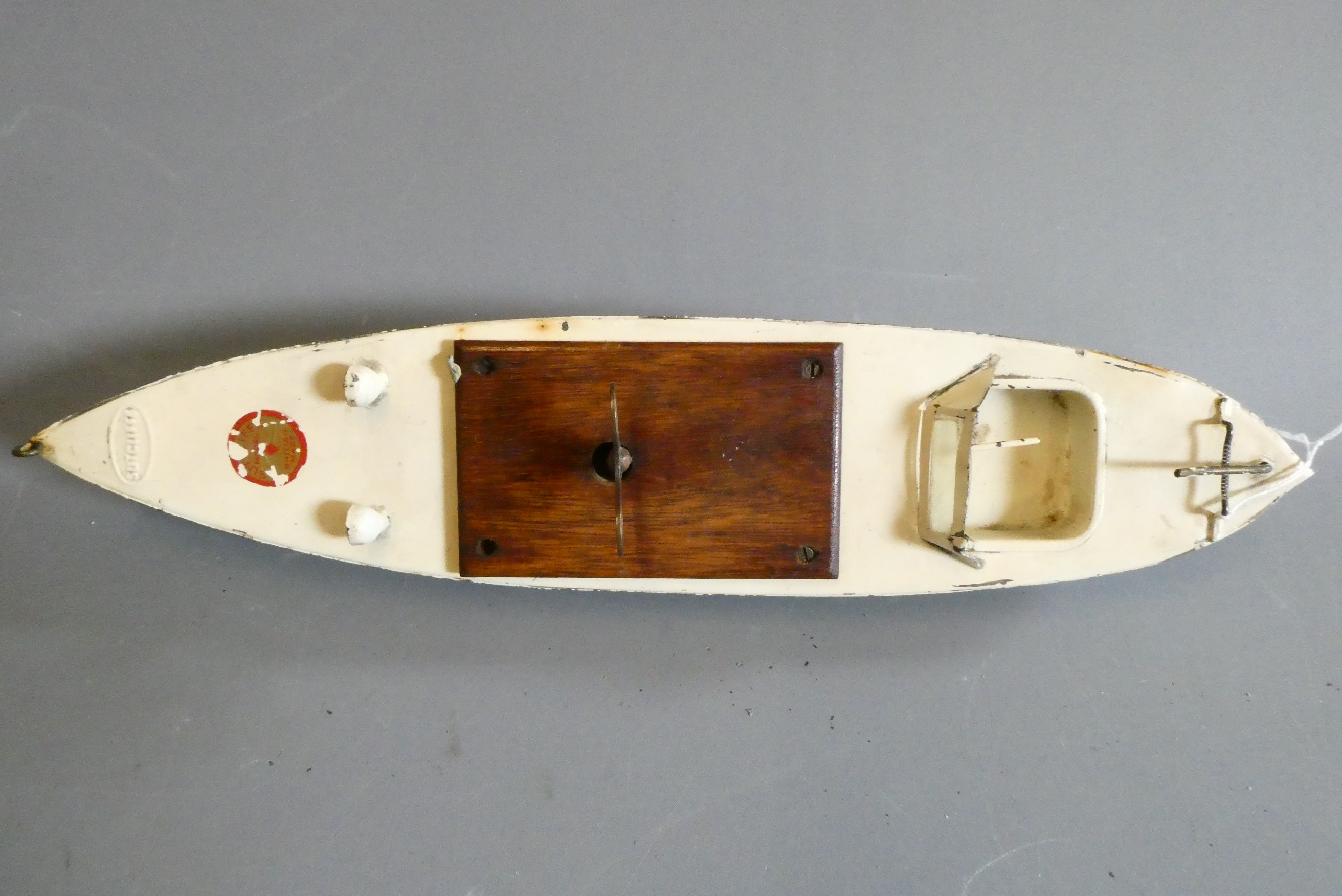 Sutcliffe models clockwork speed boat Meteor in blue and white, some minor paint and transfers loss. Image