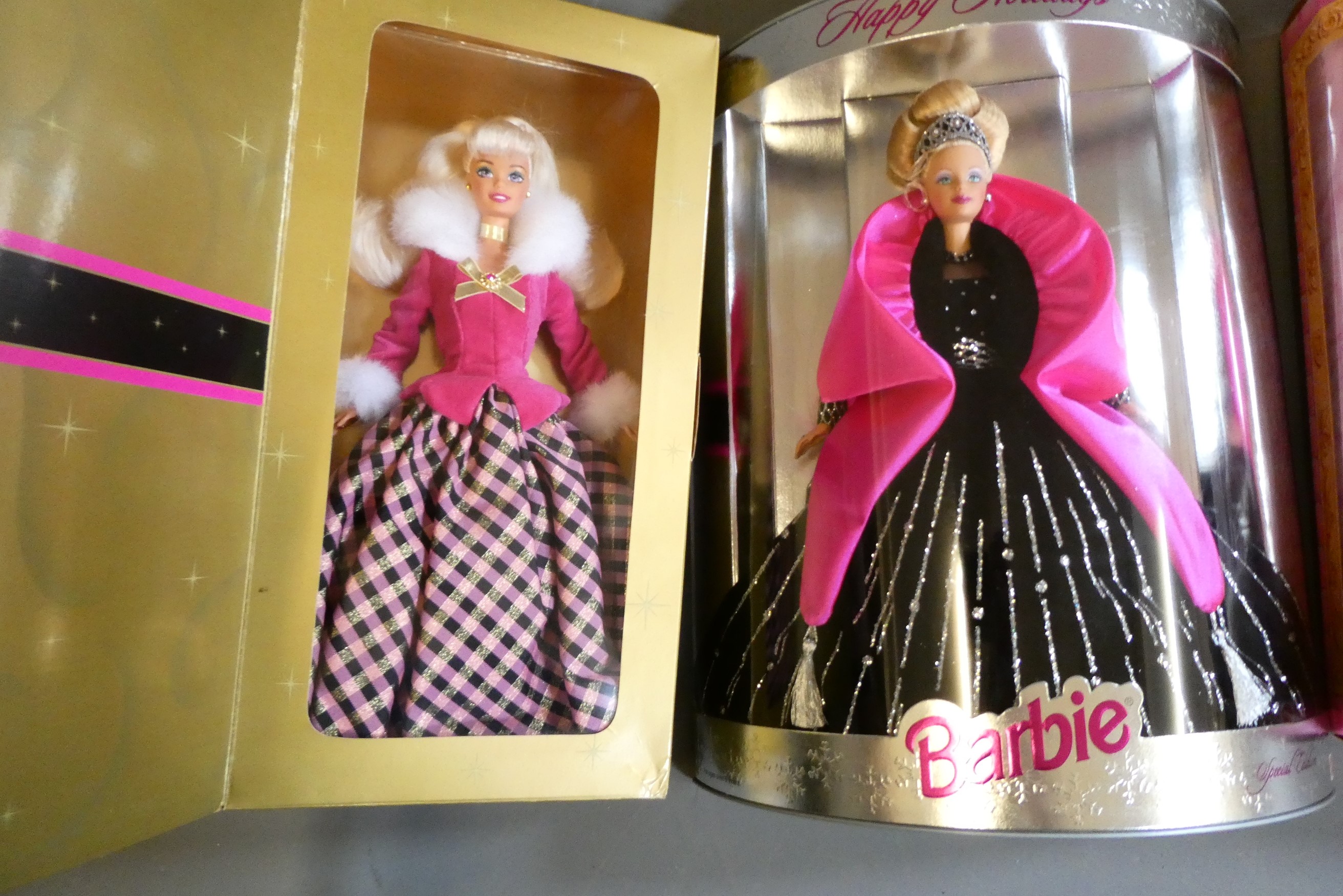 Four boxed Barbie dolls, comprising Special Edition Happy Holidays, Rapunzel, Winter Rhapsody Avon Image