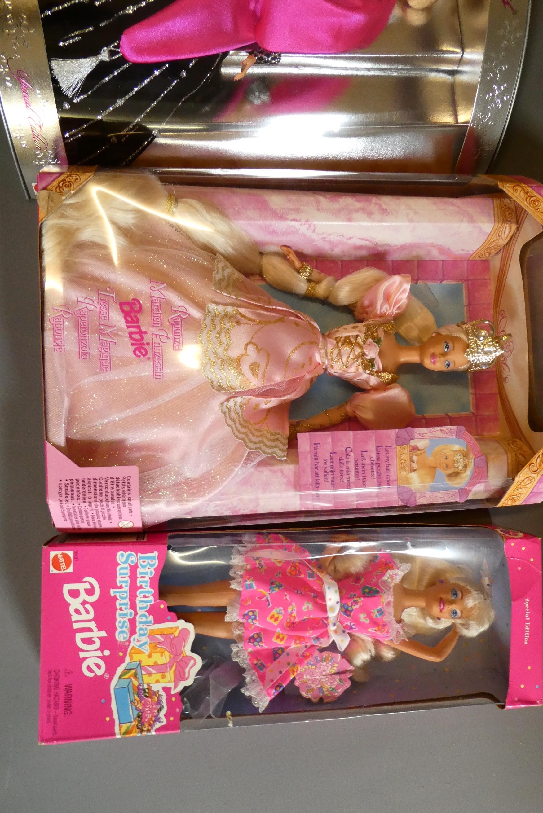 Four boxed Barbie dolls, comprising Special Edition Happy Holidays, Rapunzel, Winter Rhapsody Avon Image
