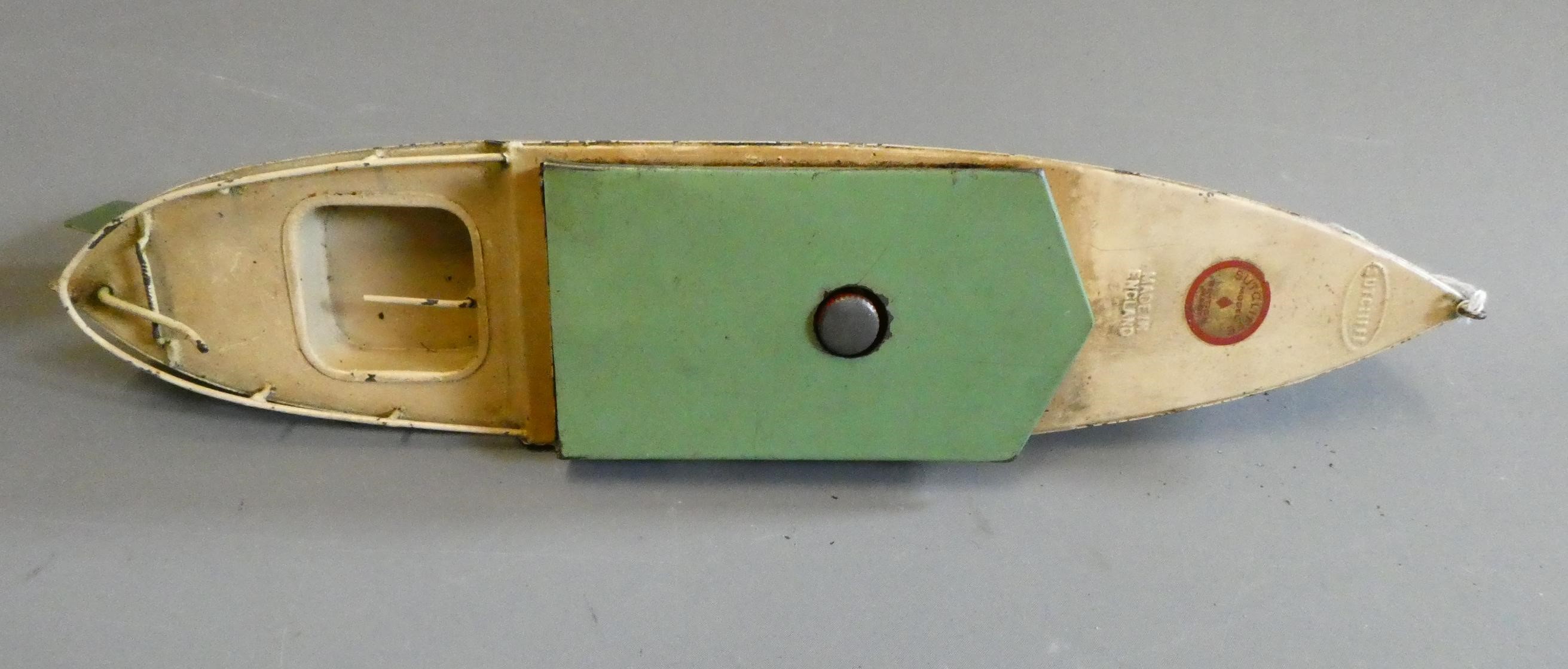 Rare Sutcliffe model clockwork cabin cruiser Commodore finished in green and cream. Clockwork motor Image