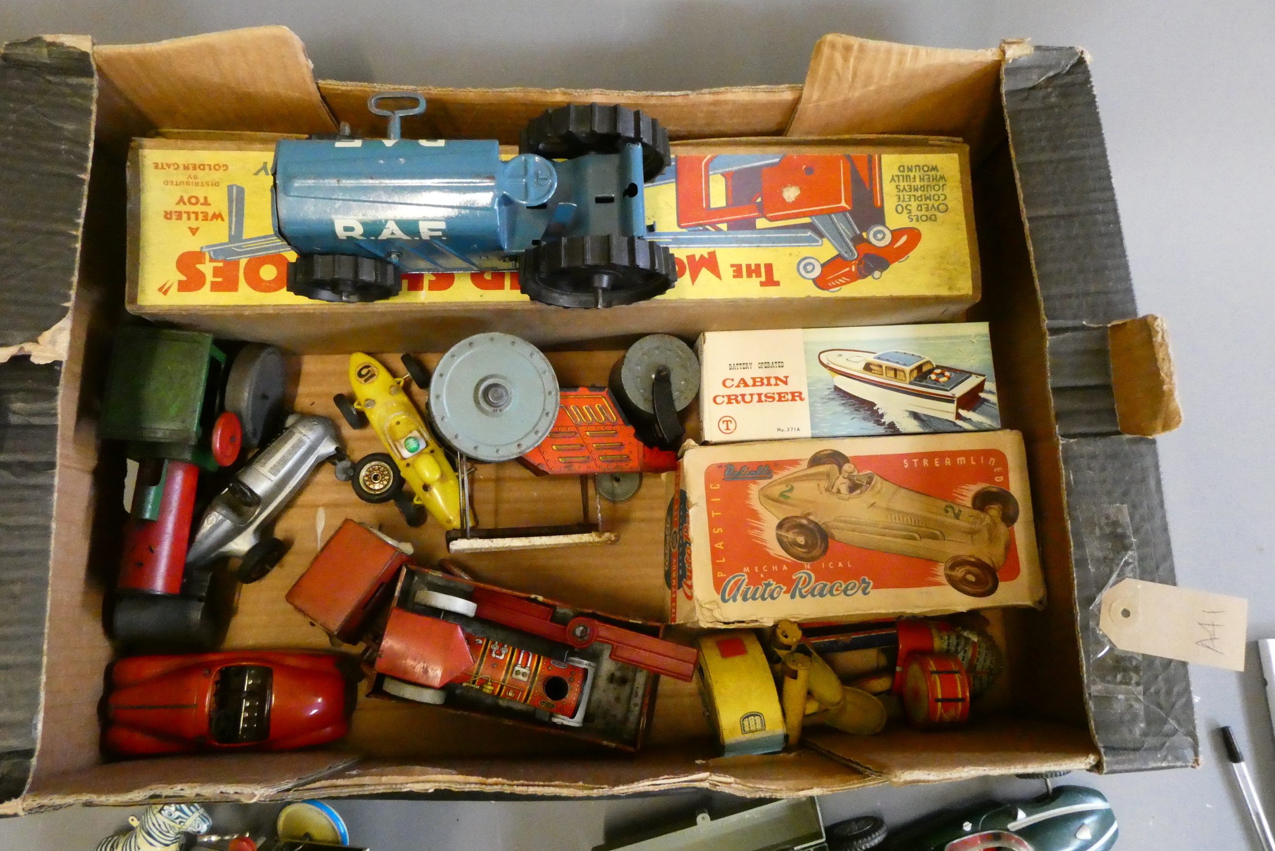 Mixed plastic and tin toys from the 1950's to 70s including RAF tractor, racing cars and clockwork Image