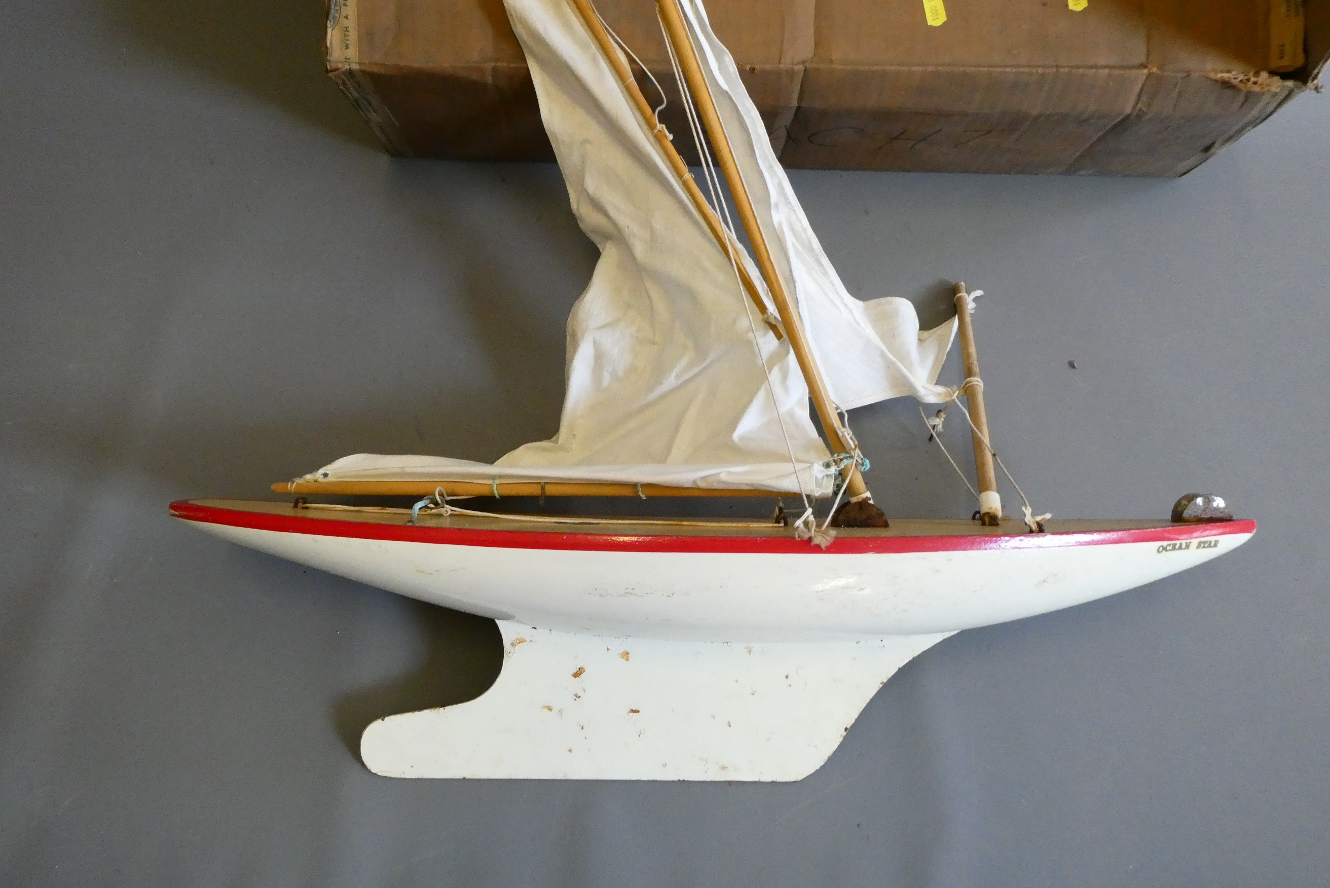 An uncommon large sized Star sailing pond yacht 'Ocean Star' finished in red/white with sails. Some Image