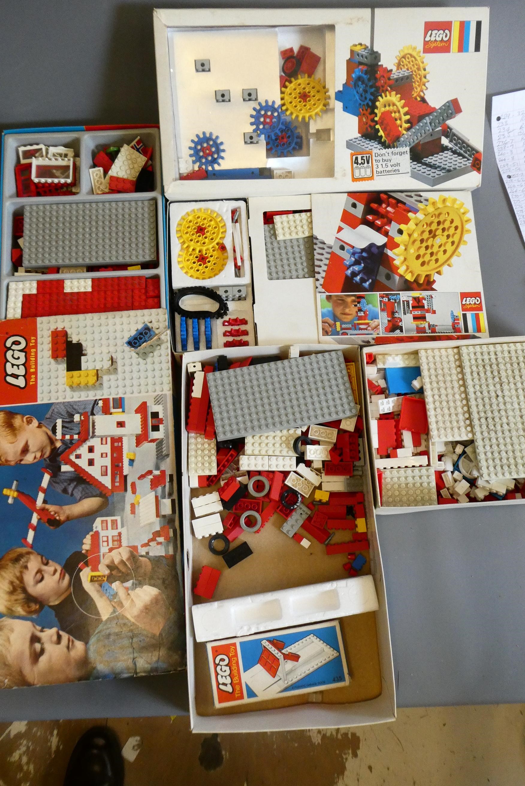 A large quantity of early Lego bricks and parts, some in original packing, others loose in box with Image
