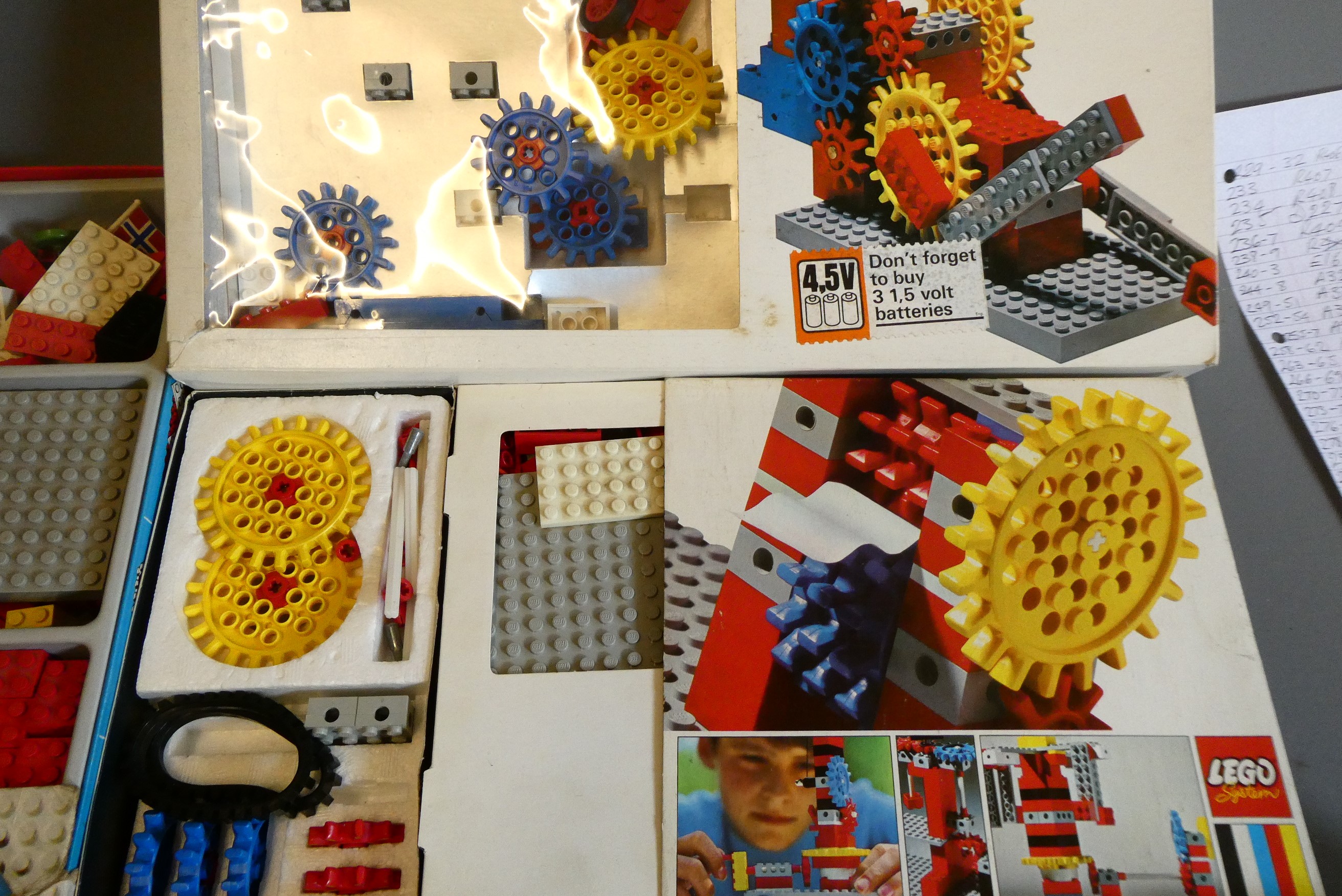 A large quantity of early Lego bricks and parts, some in original packing, others loose in box with Image