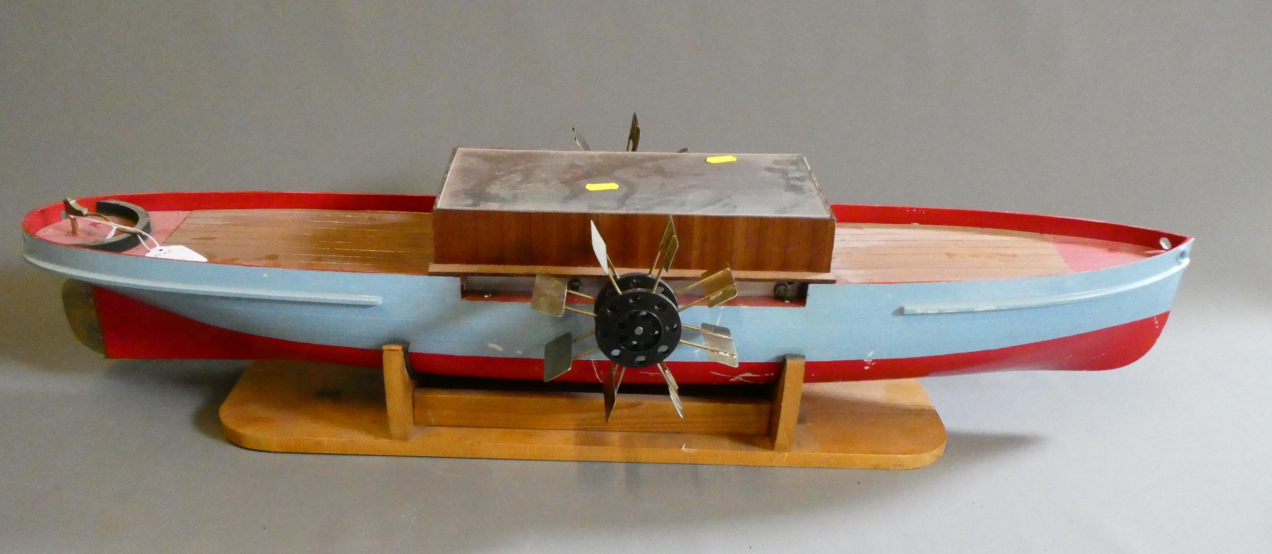 Clockwork powered model paddle boat with fibreglass and wood hull Image