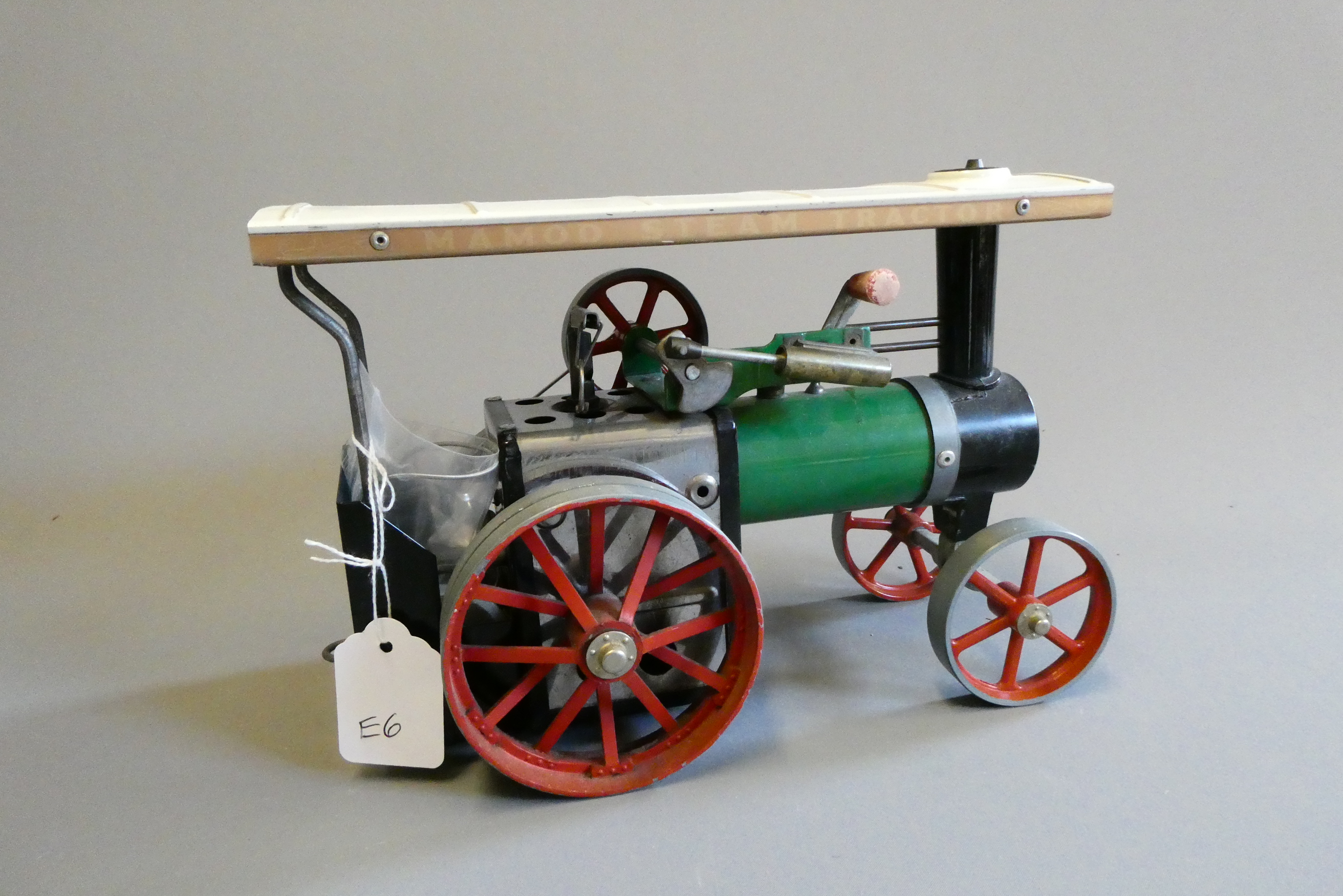 Mamod TE1 traction engine finished in green, some age wear, small dent to roof, spare drive spring. Image
