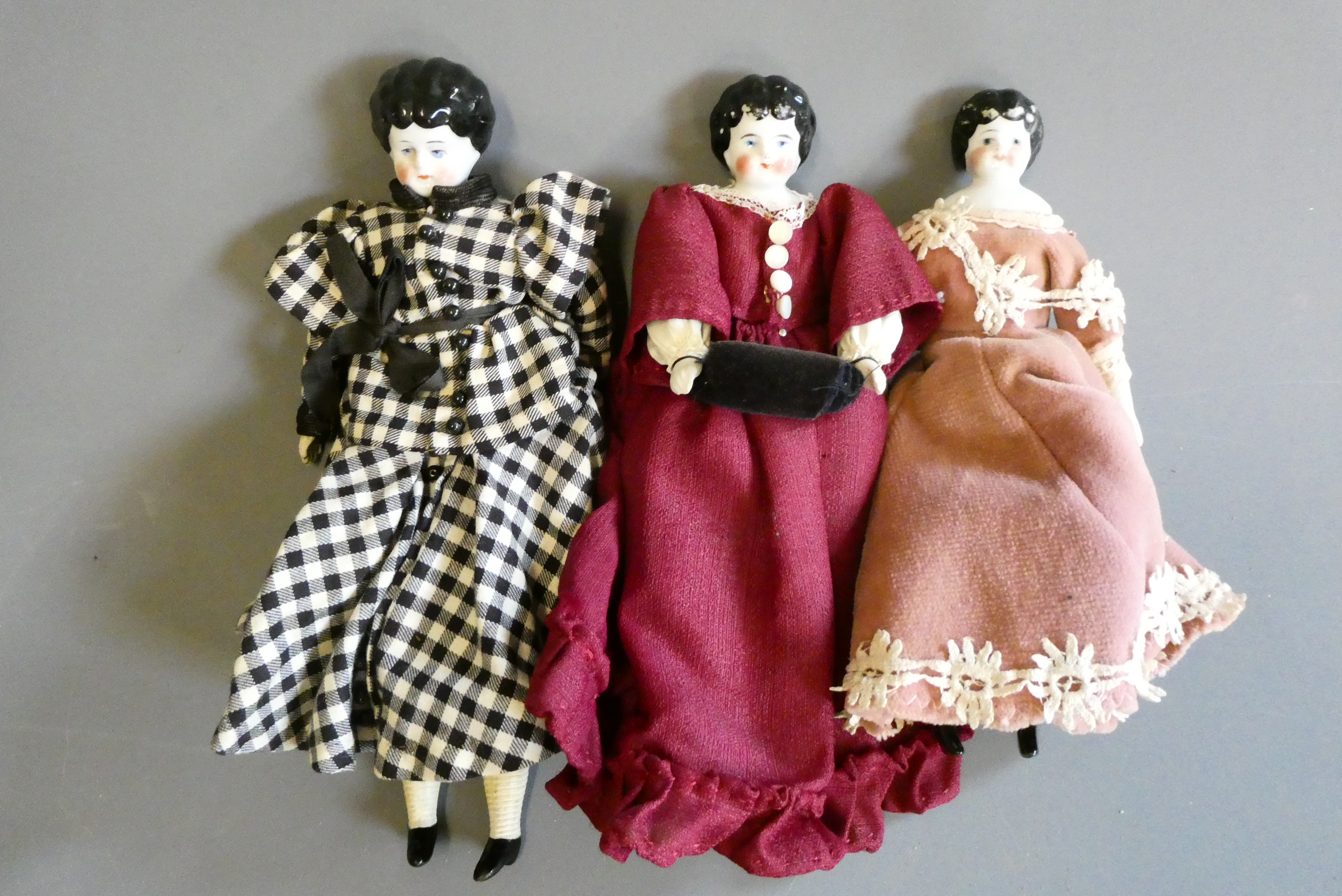 Three china head doll's house dolls Image