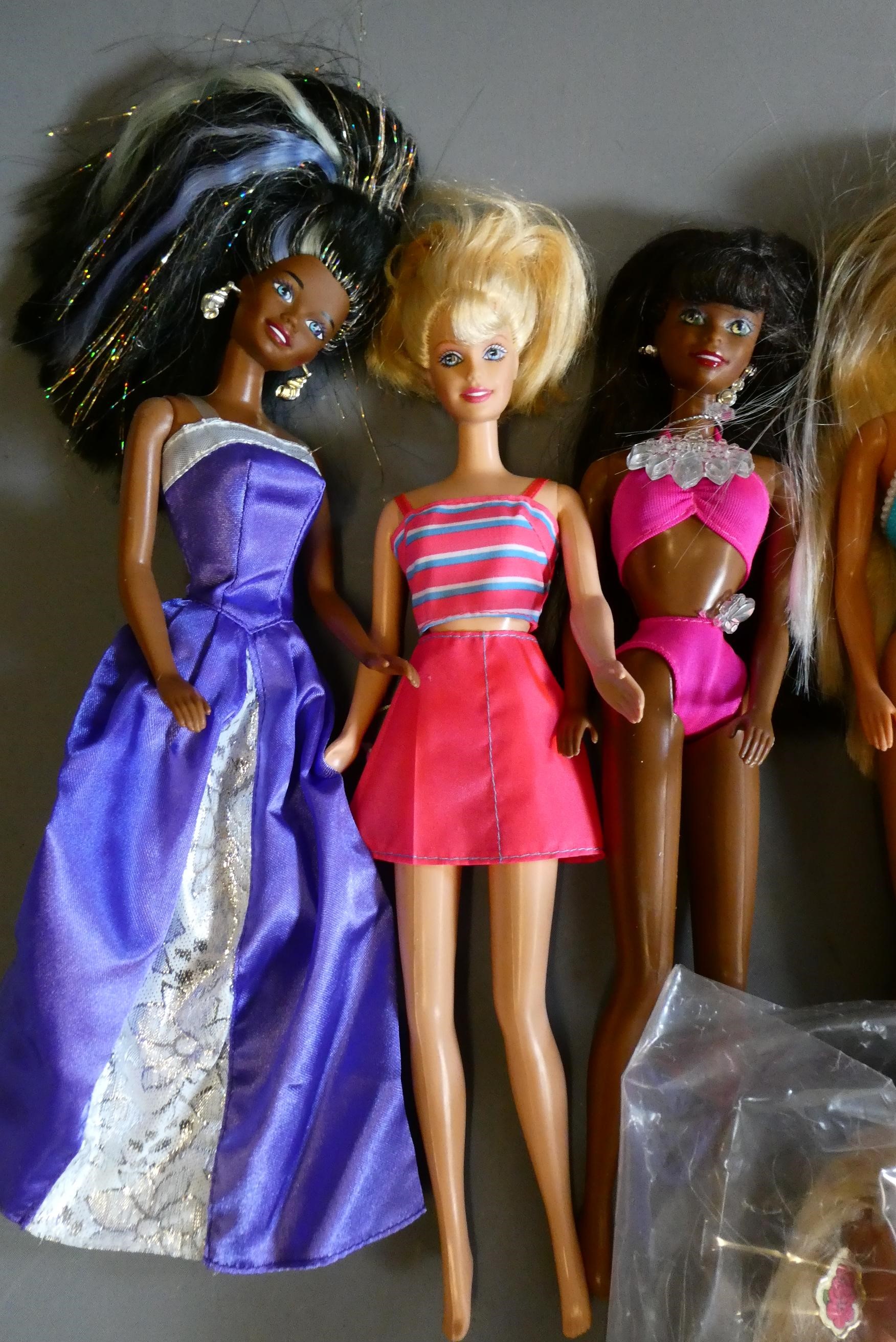 Ten Barbie dolls, including one fully jointed ballet Barbie and one with pull string spinning Image