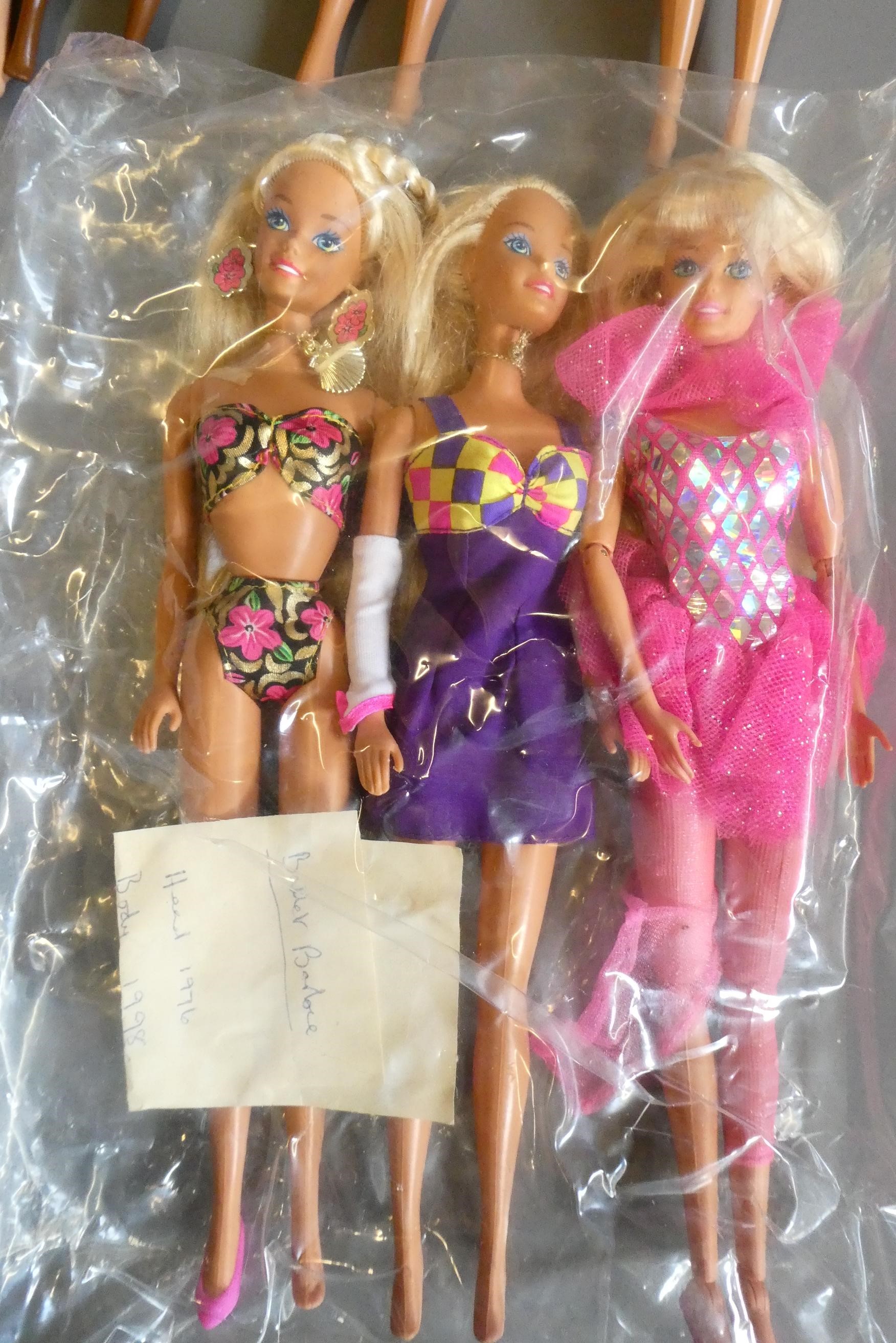 Ten Barbie dolls, including one fully jointed ballet Barbie and one with pull string spinning Image