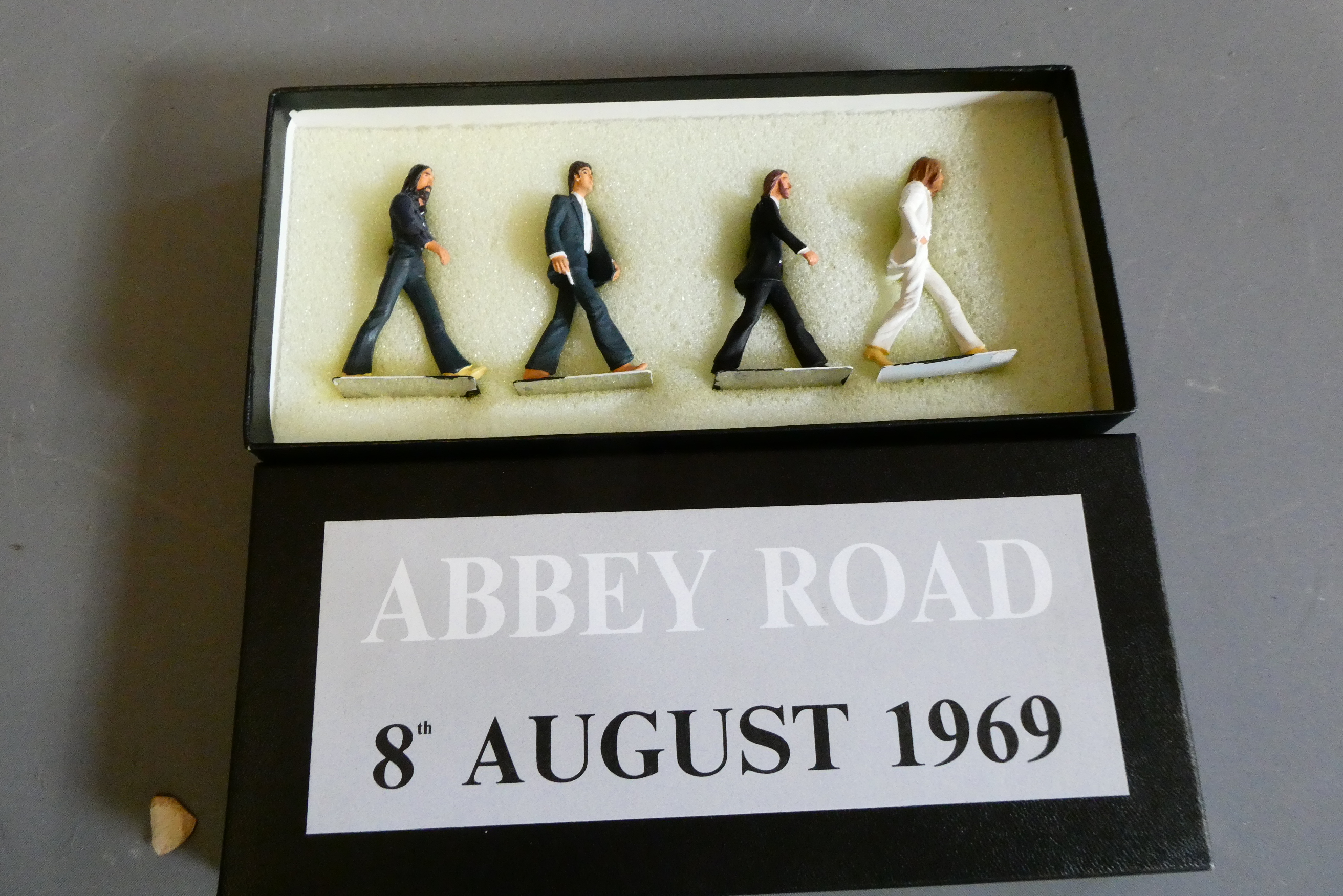 Four cast Beatles figures from 1969 Abbey Road Crossing photograph. Boxed, good (Est. plus 24% Image