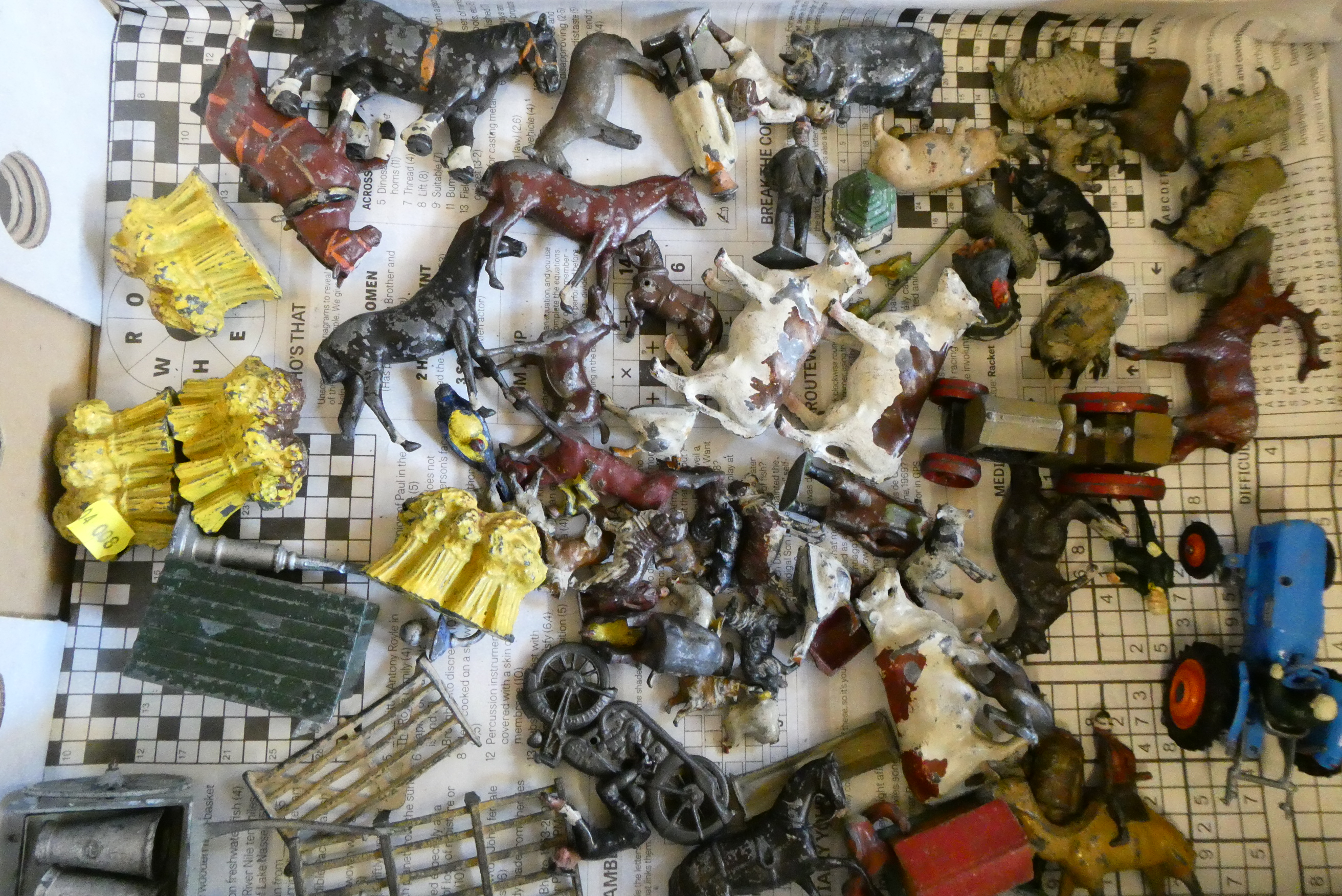 Playworn lead farm animals and farm equipment, including tractor, wheatsheaves and farm hut. Poor Image