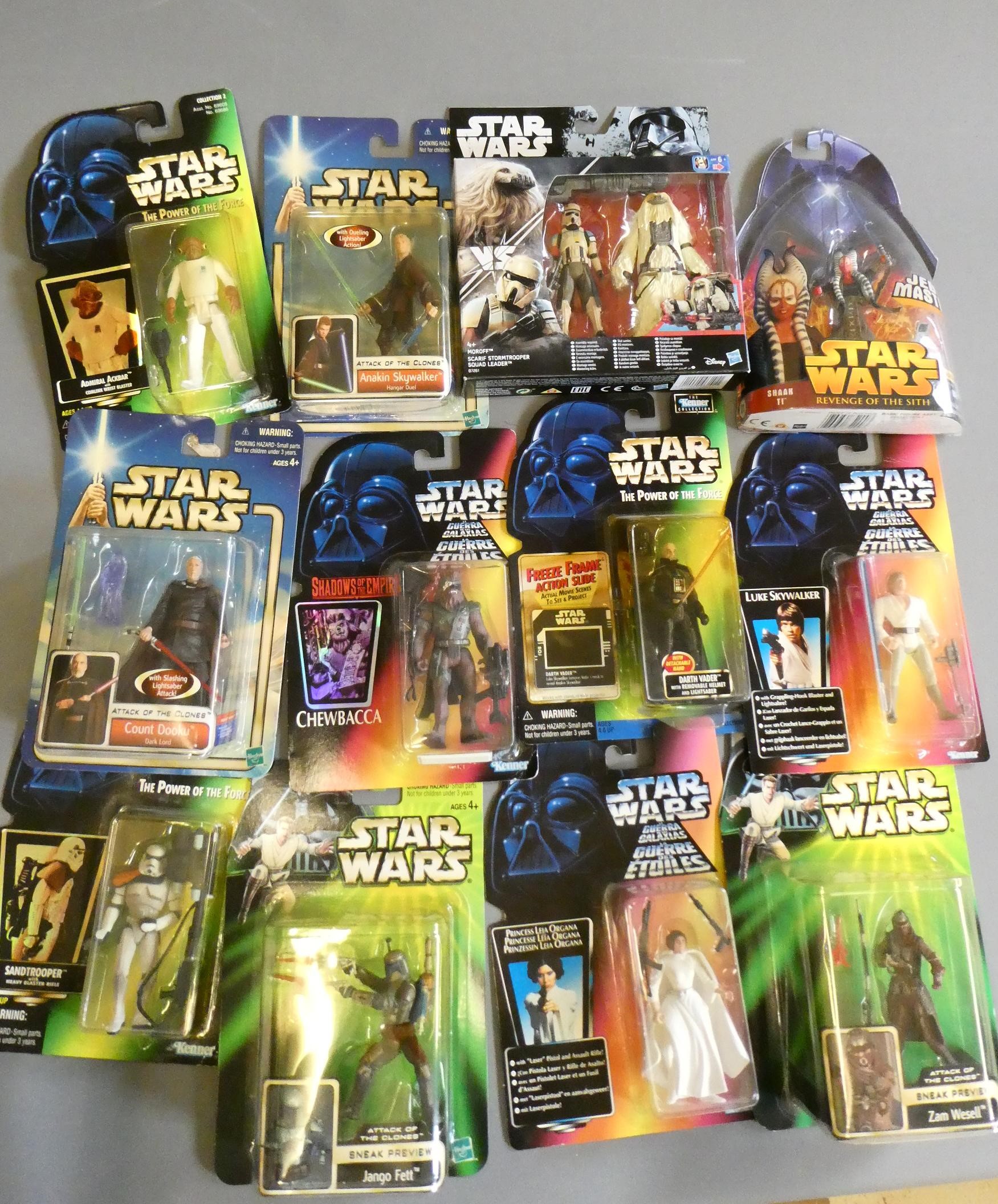 Twenty-one late reissue Star Wars toy figures from Kenner and Hasbro, all items boxed in display Image