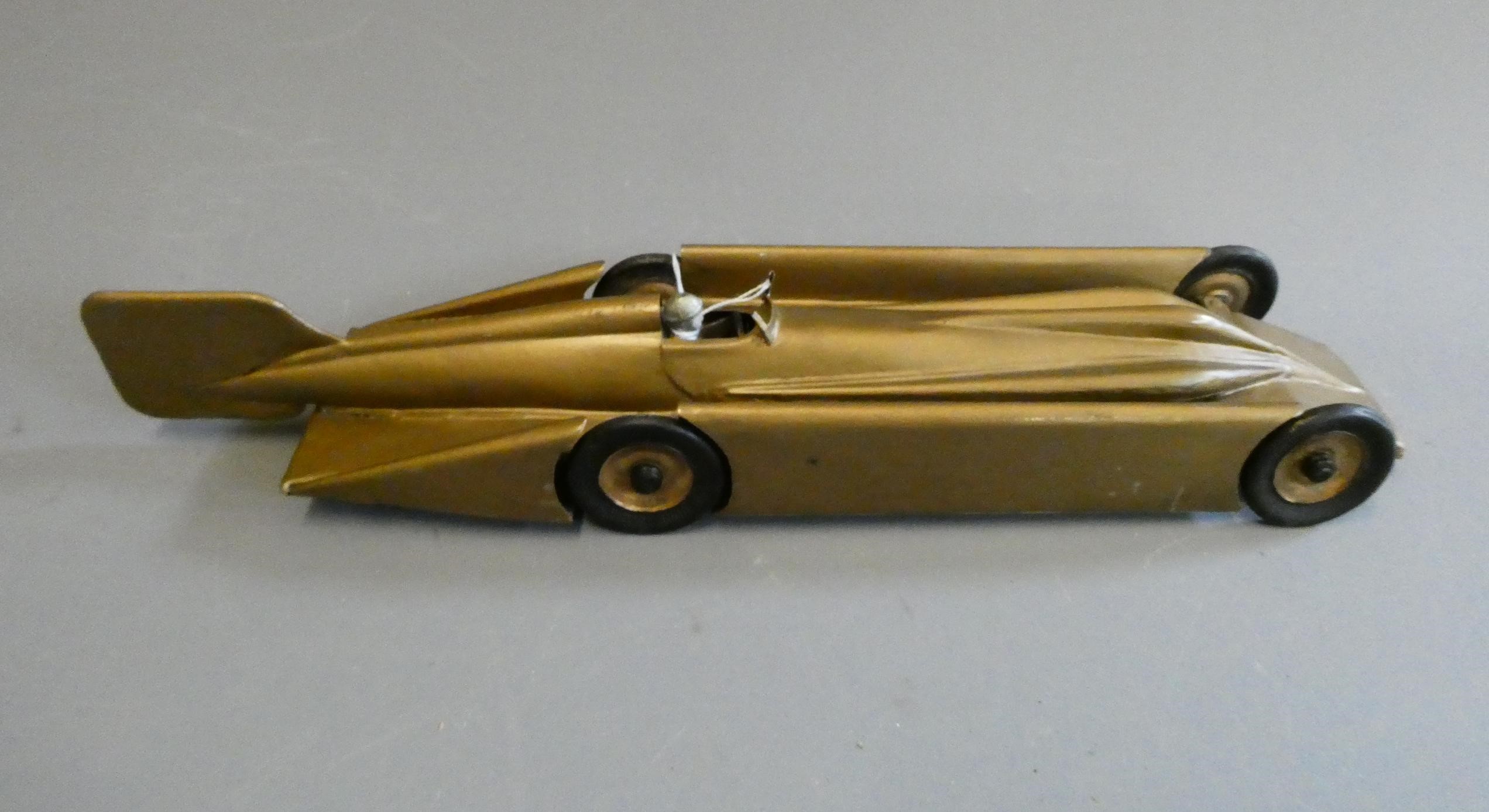 Kingsbury clockwork Golden Arrow speed record car, overpainting and repairs, loose parts, fair to Image